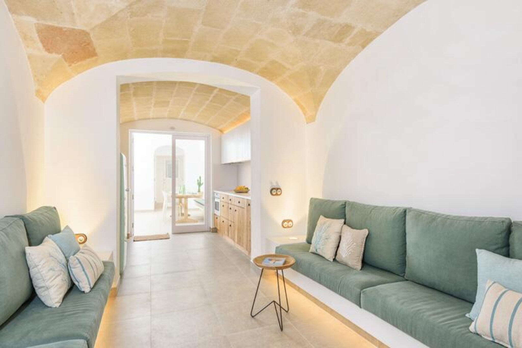 In the heart of Ciutadella de Menorca, this charming and newly built house offers a blend of modern comfort and timeless Mediterranean allure. Imagine waking up in a tastefully furnished space, stepping onto your private terrace, and enjoying the gentle warmth of the island sun. Perfectly situated in the vibrant city center, this property invites you to immerse yourself in the rich culture, history, and culinary delights of Menorca. Whether you're exploring the cobbled streets or relaxing in the garden, every moment here feels like a retreat from the ordinary. \n\nThe house boasts three cozy bedrooms and accommodates up to five guests, making it ideal for families or small groups. Its 150 m² layout is designed for both comfort and convenience, featuring air conditioning throughout, Wi-Fi access, and five televisions to cater to all your entertainment needs. The open-plan kitchen is fully equipped with induction hobs, a refrigerator, microwave, oven, freezer, dishwasher, and all the essentials for preparing delicious meals. Additional amenities such as a washing machine, iron, hairdryer, and heat pump heating ensure a seamless stay, while the fenced garden and terrace provide a private outdoor space to unwind. \n\nStep outside and discover the best of Ciutadella. The Nou Mercat supermarket is just 350 meters away, while a variety of restaurants and the Plaza de los Pinos bus station are within walking distance. Nature lovers will appreciate the nearby natural park and the Platja Gran beach, located only 1 km away. For family fun, AquaRock water park is a short drive at 7 km, and the picturesque Lago Calan Bosch is just 11 km away. With the airport conveniently located 48 km from the property, your Menorcan adventure begins the moment you arrive. \n\nWhether you're seeking relaxation, exploration, or a mix of both, this house in Ciutadella offers the perfect base for an unforgettable holiday experience.