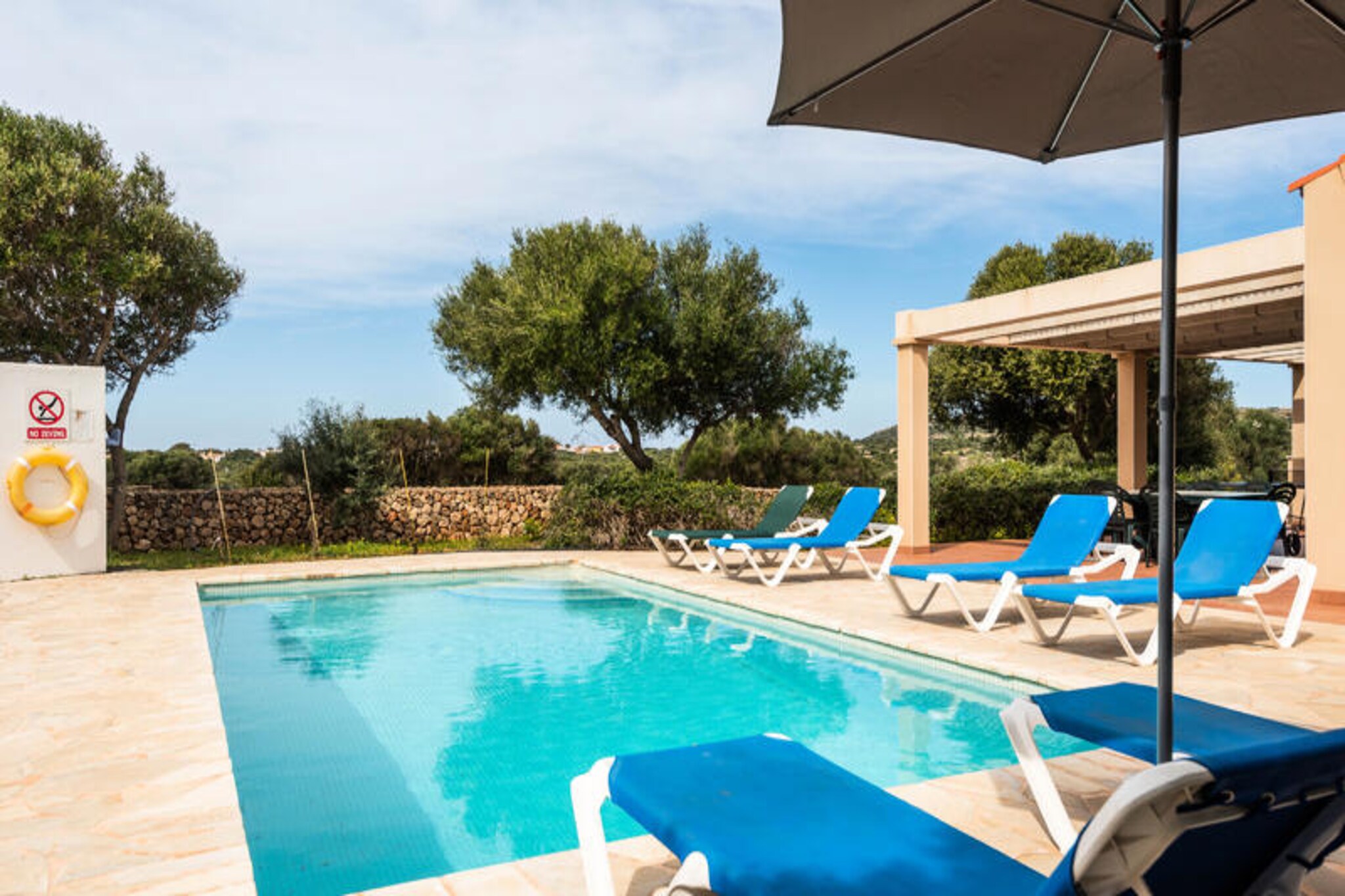 Imagine waking up to the gentle Mediterranean breeze and the serene beauty of Menorca surrounding you. Flomertor 3 is more than a villa; it’s a sanctuary of joy, comfort, and unforgettable moments. Whether you’re challenging your loved ones to a lively game of ping-pong or billiards, or simply soaking up the island’s tranquility, this villa promises a holiday filled with laughter and relaxation. Here, every corner is designed to make you feel at home, but with the added magic of Menorca’s charm. \n\nStep inside and discover a space that blends modern comfort with natural beauty. The villa features air-conditioned bedrooms with new, plush mattresses to ensure restful nights. The fully equipped kitchen invites you to prepare delicious meals, while the spacious living areas and free Wi-Fi keep everyone connected and entertained. Outside, the private garden bursts with local colors and aromas, offering a perfect setting for sunbathing, barbecues, or refreshing dips in the pool. Every detail has been thoughtfully curated to create a welcoming retreat for families, couples, or groups of friends. \n\nBeyond the villa, Menorca’s treasures await. Explore pristine beaches, charming villages, and scenic trails that showcase the island’s unique character. Whether you’re seeking adventure or peaceful moments, Flomertor 3 is ideally located to experience it all. Return each day to your private haven, where the laughter continues and memories are made. \n\nChoose Flomertor 3 for your next getaway and discover why Menorca is a destination like no other. This is where your perfect holiday begins.