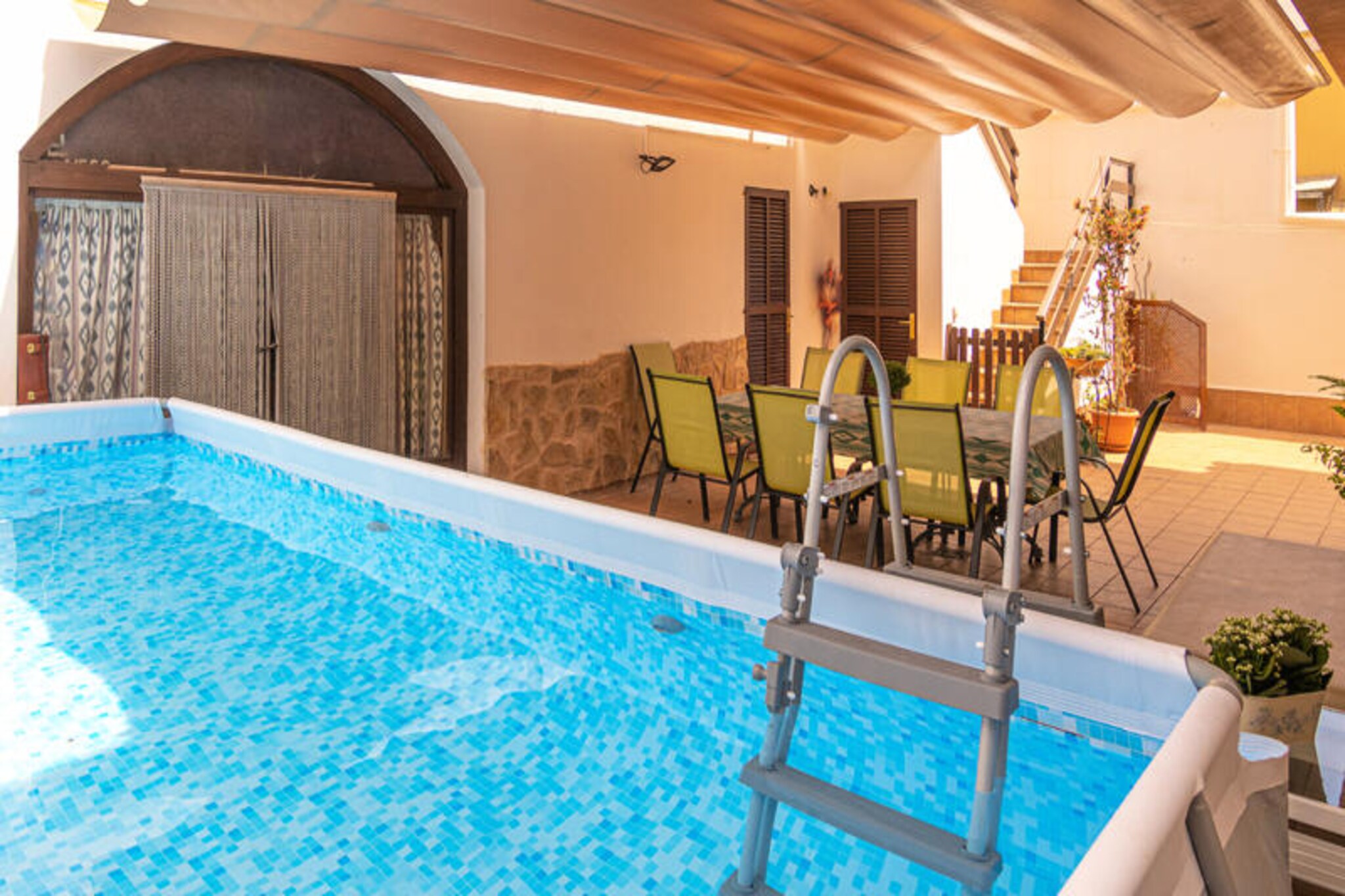 Amid the timeless charm of Muro, this spacious village house invites you to experience the true essence of Mallorca. Surrounded by cobblestone streets and traditional architecture, this home is a haven for families and groups seeking a blend of comfort, authenticity, and Mediterranean beauty. With its serene setting and proximity to Mallorca’s stunning beaches, it’s the perfect retreat for those looking to unwind and explore.
Spanning 400 m², the house comfortably accommodates up to 8 guests across 4 bedrooms—two with double beds and two with twin beds. The living room is a cozy hub, featuring plush sofas, satellite TV, a DVD player, and Wi-Fi, ensuring entertainment for all. The fully equipped kitchen is ideal for preparing meals to enjoy on the 70 m² terrace, which boasts a private swimming pool and barbecue area. With air conditioning and central heating, your stay is comfortable year-round, whether you’re escaping the summer heat or enjoying a winter getaway.
Muro’s charm lies in its peaceful atmosphere and proximity to Mallorca’s treasures. Explore the town’s quaint streets, indulge in local cuisine, or take a short drive to the island’s breathtaking beaches. For nature enthusiasts, the nearby Albufera Natural Park offers a haven of wildlife and scenic trails. Whether you’re seeking relaxation or adventure, this location provides the best of both worlds.
Book your stay today and immerse yourself in the magic of Muro. From tranquil mornings by the pool to evenings exploring the local culture, this village house promises an unforgettable Mallorcan escape.