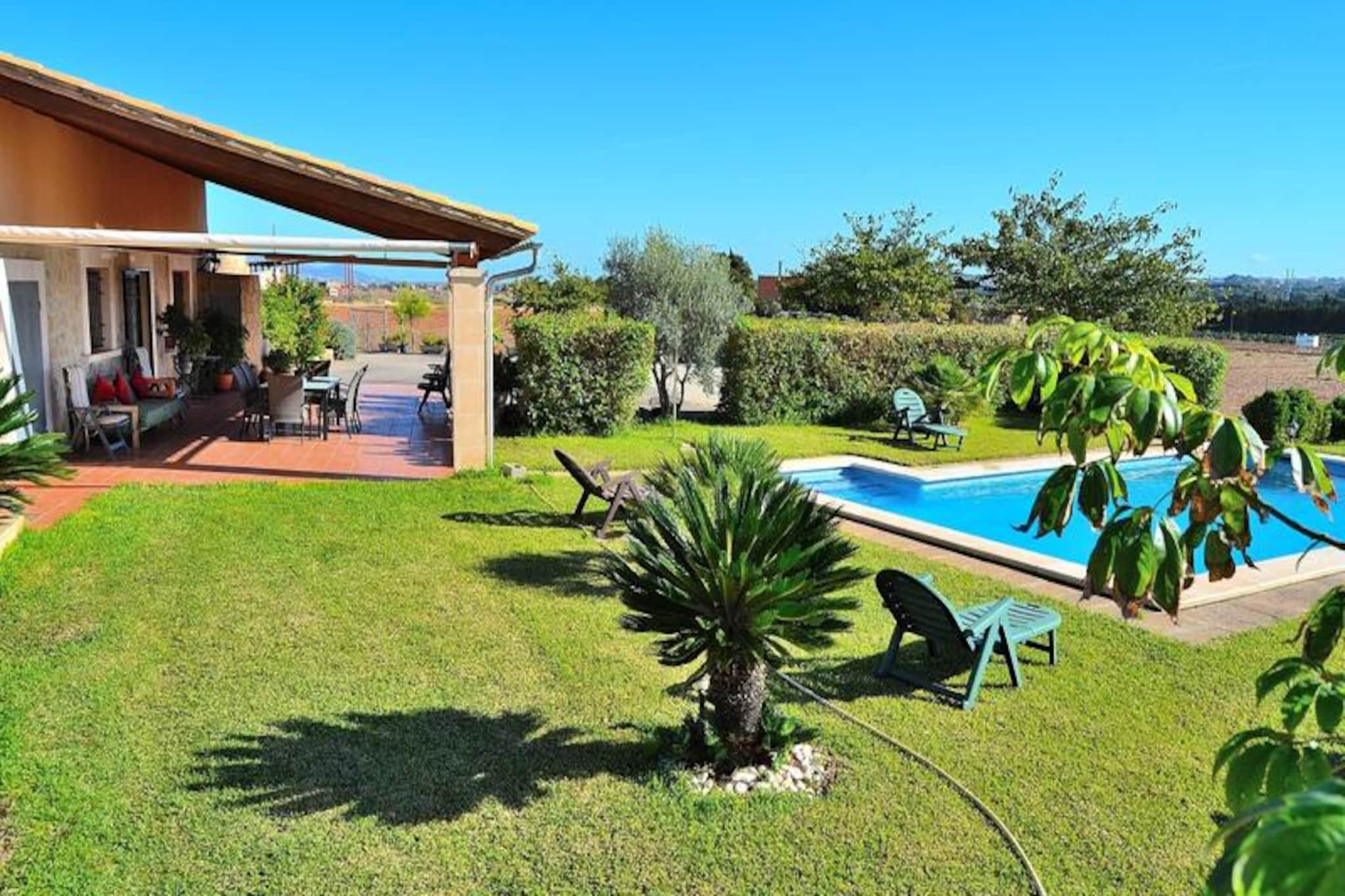 Amidst the serene countryside of Mallorca, this charming property offers a tranquil escape with breathtaking views of the picturesque village of Muro. Just 2 km away from the heart of the village, this retreat combines modern comfort with the timeless beauty of the Mediterranean, making it an ideal haven for couples or small families seeking relaxation and authenticity. The peaceful surroundings invite you to unwind and immerse yourself in the island’s natural charm. \n\nThe property comfortably accommodates up to four guests with two thoughtfully designed bedrooms: one featuring a cozy double bed and the other with two single beds. A modern bathroom with a shower ensures convenience, while the fully equipped kitchen and adjoining living/dining area provide a welcoming space for shared meals and moments. Air conditioning in the main living area ensures a pleasant stay, even during the warm summer months. \n\nStep outside to discover a private oasis. The expansive 500 m² garden is a highlight, featuring a stunning 11x5 meter swimming pool surrounded by sun loungers, perfect for soaking up the Mallorcan sun. A barbecue area and outdoor furniture make al fresco dining a delight, allowing you to savor the island’s mild evenings under the stars. \n\nLocated near the charming village of Muro, you’ll find cobblestone streets, traditional Mallorcan architecture, and a warm local culture to explore. The property’s proximity to pristine beaches and exquisite dining options ensures a perfect balance of relaxation and adventure. Whether you’re lounging by the pool or exploring the island’s treasures, this property promises an unforgettable Mallorcan getaway.