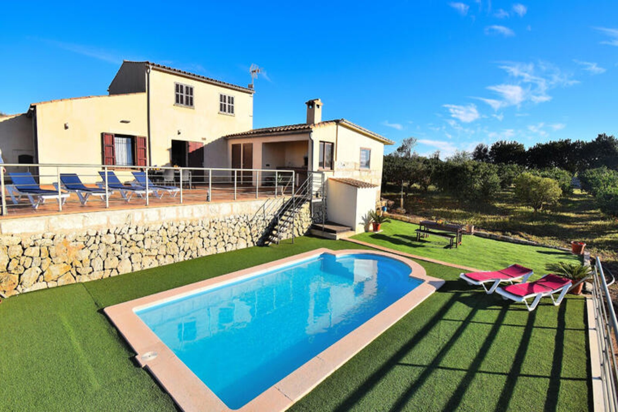 Amidst the serene countryside of Mallorca, this charming two-story rustic house offers a tranquil retreat just minutes from the vibrant town of Inca. Here, you can explore bustling shopping areas and discover renowned leather and shoe factories. For beach lovers, the golden sands of C'an Picafort are only a 15-minute drive away, promising sun-soaked days by the Mediterranean. The property is perfectly positioned to enjoy both the peaceful rural setting and the lively attractions of nearby towns and beaches. \n\nInside, the house boasts three comfortable bedrooms: two with double beds and one with twin beds. One of the double bedrooms features an en-suite bathroom, while two additional bathrooms with showers ensure convenience for all guests. The fully equipped kitchen leads into a cozy dining area and a spacious living room complete with Wi-Fi, TV, and a DVD player, creating a welcoming space to relax after a day of exploration. \n\nStep outside to the expansive terrace, where breathtaking panoramic views of orange groves, charming villages, and the majestic Serra de Tramuntana mountains await. The terrace is equipped with a traditional stone barbecue, ideal for preparing delicious meals to enjoy al fresco. Adjacent to the terrace, the saltwater pool and sun loungers provide the perfect setting for soaking up the Mallorcan sun and sharing joyful moments with family or friends. \n\nWhether you’re seeking relaxation, adventure, or a taste of authentic Mallorcan culture, this rustic retreat offers it all. With its idyllic location, comfortable amenities, and proximity to both nature and vibrant local life, this property is the perfect choice for an unforgettable holiday in Mallorca.