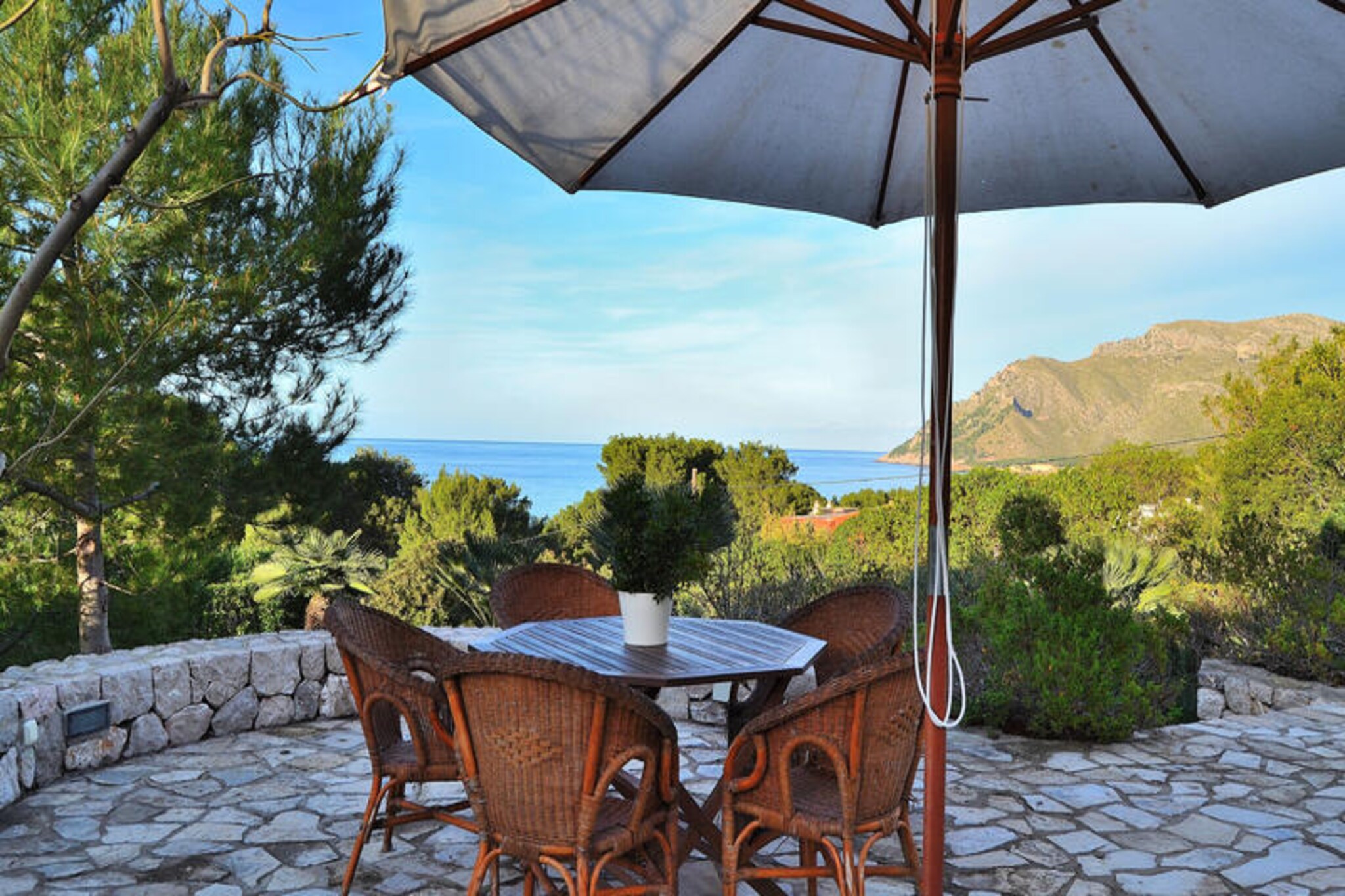 In the peaceful village of Betlem, where the Mediterranean meets the mountains, this charming holiday home invites you to experience the essence of Mallorca. Surrounded by breathtaking coastal views and lush greenery, this property offers a serene retreat just 250 meters from the beach. Whether you’re seeking relaxation or adventure, Betlem provides the perfect backdrop for an unforgettable getaway. Wake up to the gentle sound of waves and enjoy the tranquility of this idyllic setting. \n\nThe holiday home is thoughtfully designed to accommodate up to six guests. It features two cozy bedrooms, one with a double bed and en-suite bathroom, and the other with two single beds that connect to a living room with a sofa bed. The spacious living and dining area is perfect for gathering, with comfortable sofas, a large dining table, and modern amenities like a TV, DVD/CD player, and internet access. The fully equipped kitchen makes meal preparation a breeze, while the rooftop terrace offers stunning sea and mountain views, complete with high-quality furniture and an outdoor barbecue for memorable evenings. \n\nStep outside to discover the private 9x4m swimming pool surrounded by Mediterranean plants, a ping-pong table, and comfortable sun loungers on the soft lawn. The terrace in front of the house provides a direct view of the sea, creating the perfect spot for morning coffee or sunset relaxation. With its proximity to the beach and well-maintained garden, this home is a haven for outdoor living. \n\nBetlem is a hidden gem of Mallorca, offering pristine coves, scenic trails, and authentic island charm. Explore nearby Colonia de Sant Pere for shopping and dining, or simply immerse yourself in the natural beauty of the area. Whether you’re enjoying the pool, savoring local cuisine, or discovering Mallorca’s coastal treasures, this holiday home promises a magical escape. Let the serenity of Betlem captivate you and create memories to last a lifetime.