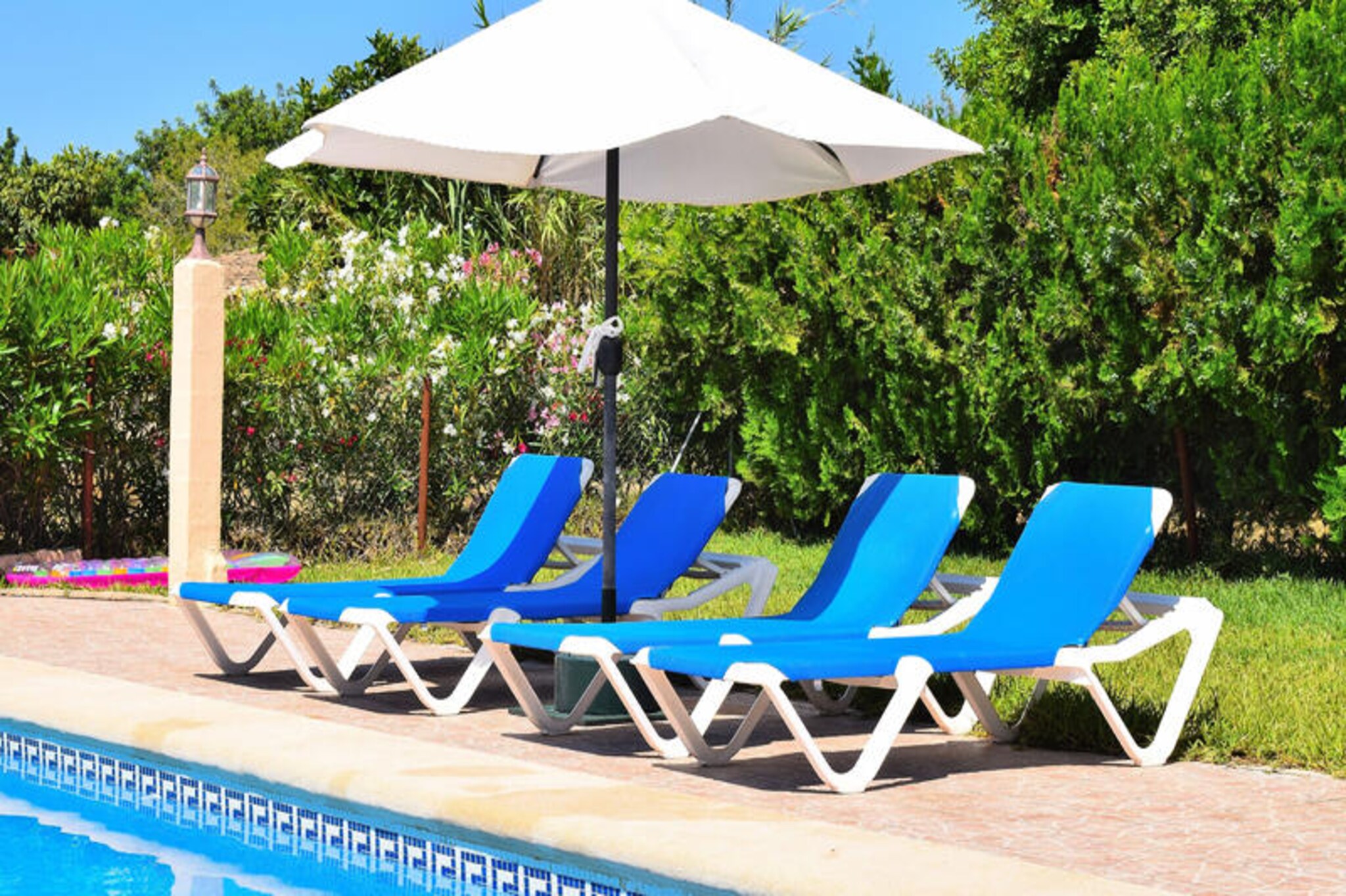 Step into the tranquil embrace of Buger, a hidden gem in the heart of Mallorca, where time slows down and the beauty of the countryside unfolds before your eyes. This charming 80 m² apartment offers an idyllic retreat surrounded by lush gardens and breathtaking mountain views, perfect for families or couples seeking a peaceful getaway. The village of Buger, with its cobbled streets and authentic Mallorcan charm, is just 2 km away, offering a taste of local life and tradition. Whether you’re looking to unwind or explore, this property is your gateway to the island’s serene landscapes and vibrant culture. \n\nInside, the apartment is thoughtfully designed to combine comfort and practicality. With two cozy bedrooms accommodating up to four guests, it’s ideal for intimate gatherings. The American-style kitchen is fully equipped with modern appliances, including a refrigerator, microwave, oven, and coffee maker, ensuring you have everything you need to prepare delicious meals. The living area features satellite TV in multiple languages, Wi-Fi, and a fireplace, creating a warm and inviting space to relax after a day of adventure. Step outside to enjoy the 100 m² terrace, complete with garden furniture, a barbecue, and a private swimming pool, perfect for soaking up the Mediterranean sun. \n\nThe property’s location is a dream for explorers. Just 24 km away, you’ll find the sandy beaches of Can Picafort and the rocky shores of Alcanada, ideal for sunbathing or snorkeling. Golf enthusiasts can tee off at the nearby Alcanada Golf course, while families will love the thrills of Hidropark Alcúdia, only 19 km away. For daily conveniences, the Sa Pobla supermarket is a short drive, and public transport options are easily accessible. Buger’s central location makes it a perfect base for discovering Mallorca’s hidden treasures, from historic towns to scenic hiking trails. \n\nEscape to this serene haven and experience the authentic charm of Mallorca. Whether you’re enjoying a quiet evening by the fireplace or exploring the island’s wonders, this property promises unforgettable memories in a setting that feels like home.