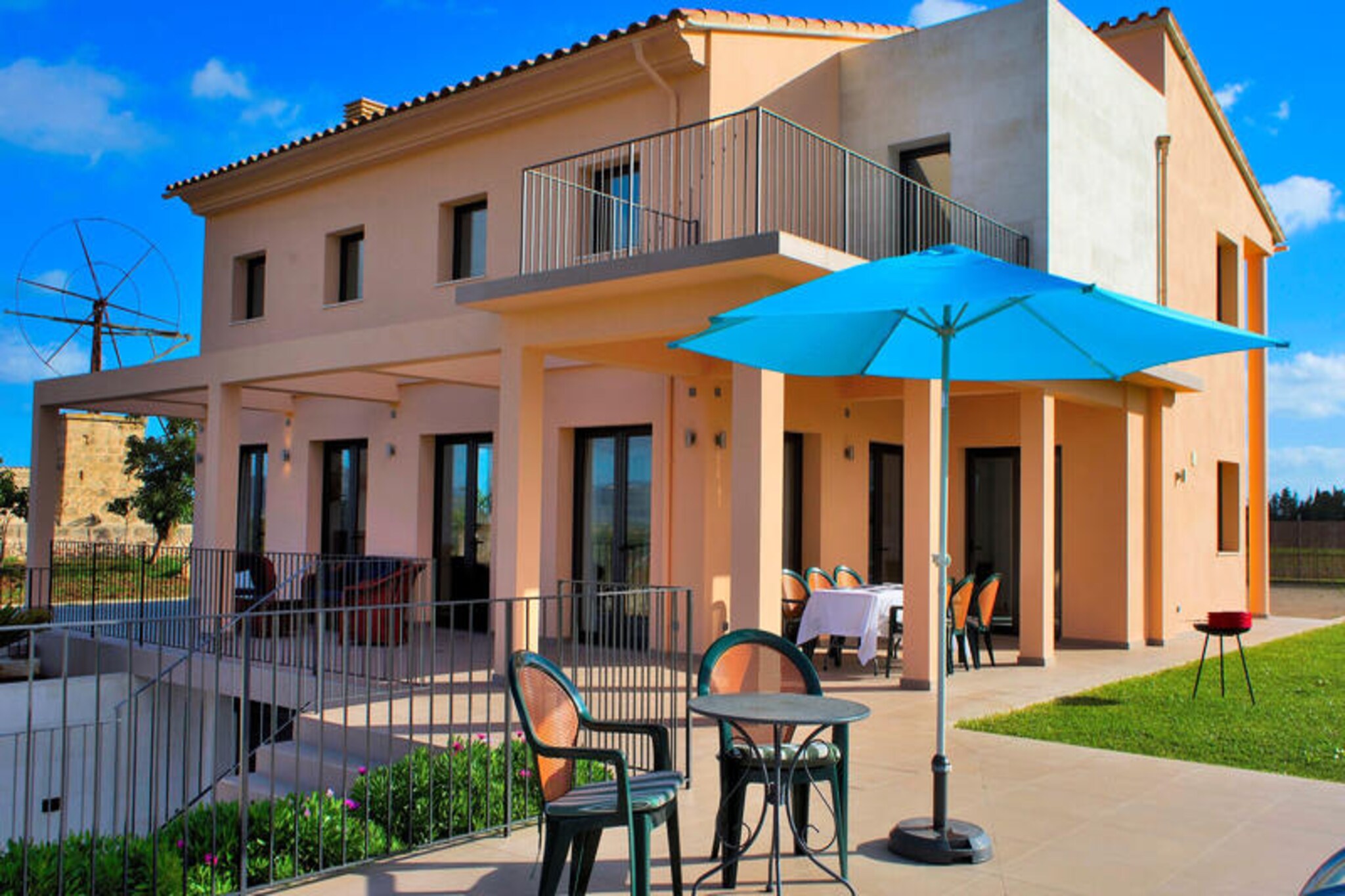 In the heart of Mallorca's serene northern countryside, this stunning villa offers a perfect retreat for families and friends seeking both relaxation and adventure. Surrounded by picturesque fields and just a short drive from the golden beaches of Can Picafort and Muro, this property invites you to experience the island's natural beauty and Mediterranean charm. Wake up to the gentle sounds of nature, enjoy your morning coffee on the covered terrace, and let the day unfold at your own pace. \n\nThe villa comfortably accommodates up to eight guests across four spacious bedrooms, each featuring two single beds. With three modern bathrooms equipped with showers, a fully equipped kitchen, and a bright, open-plan living and dining area, the home is designed for both comfort and convenience. Large windows flood the space with natural light, creating an airy and welcoming atmosphere. The entire house is air-conditioned, ensuring a pleasant stay even during the warmest summer days. \n\nStep outside to discover a private oasis. The outdoor area boasts a sparkling swimming pool, sun loungers for basking in the Mediterranean sun, and a barbecue for al fresco dining. The covered terrace, furnished with comfortable seating, is the perfect spot to unwind with a glass of local wine as the sun sets over the Mallorcan landscape. \n\nLocated just 5 km from pristine beaches, charming restaurants, and local supermarkets, the villa offers easy access to everything you need for a memorable holiday. Explore the nearby village of Muro, known for its authentic Mallorcan character, cobbled streets, and traditional architecture. Whether you're seeking tranquility, cultural exploration, or seaside fun, this villa is your gateway to the best of Mallorca.