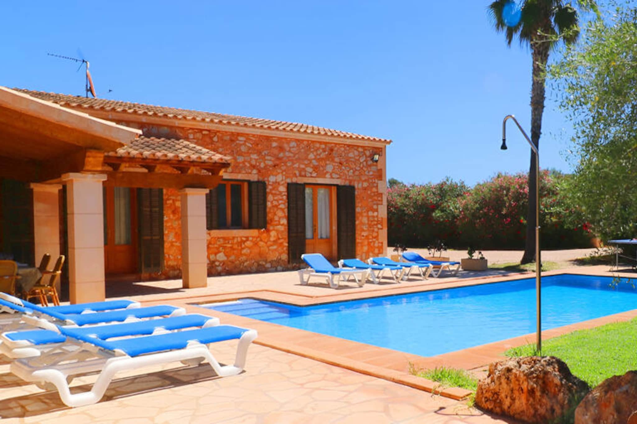 Amid the serene countryside of southern Mallorca, this charming villa offers a tranquil escape for families and friends seeking relaxation and adventure. With its idyllic location between the villages of Campos and Santanyí, you’ll find yourself surrounded by lush landscapes and just a short drive from some of the island’s most stunning beaches. Whether you’re soaking up the Mediterranean sun or exploring the vibrant local culture, this property is the perfect base for your Mallorcan getaway.
Spanning an impressive 250 m², the villa comfortably accommodates up to eight guests across four beautifully appointed bedrooms—two with double beds and two with twin beds. Inside, you’ll discover a welcoming living and dining area complete with satellite TV and Wi-Fi, as well as a fully equipped kitchen ideal for preparing delicious meals. The house features two bathrooms indoors and an additional outdoor bathroom for added convenience.
Step outside to discover your private oasis. The expansive 10x5m swimming pool invites you to cool off, while the sun loungers and terrace provide the perfect setting for unwinding or enjoying al fresco dining. A barbecue area and ping-pong table in the garden add to the fun, ensuring entertainment for all ages. From the terrace and porch, you’ll enjoy picturesque views of the pool and lush greenery, creating a truly relaxing atmosphere.
Located just 16 minutes from pristine beaches and close to essential amenities like restaurants, supermarkets, and pharmacies, this villa combines comfort, convenience, and natural beauty. Whether you’re exploring the historic streets of Campos, indulging in local cuisine, or simply basking in the tranquility of your surroundings, this property promises an unforgettable stay in Mallorca.