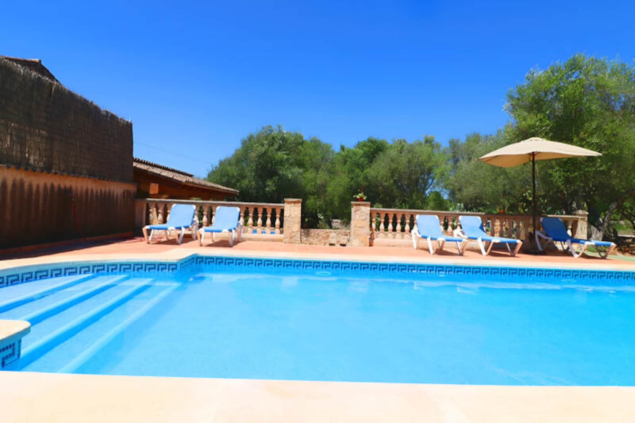 Amidst the tranquil countryside of southern Mallorca, this charming farmhouse invites you to experience the authentic beauty of the island. Surrounded by lush greenery and just a short drive from the picturesque village of Campos, this property offers a serene retreat for families and friends seeking relaxation and adventure. With its rustic stone walls, vaulted ceilings, and Mediterranean charm, every corner of this home exudes warmth and character. Whether you're lounging by the pool or exploring the nearby beaches, this farmhouse promises unforgettable moments under the Mallorcan sun. \n\nInside, the farmhouse boasts 150 square meters of thoughtfully designed living space, accommodating up to five guests. The cozy living-dining area features two comfortable sofas, a fireplace, satellite TV, and Wi-Fi, creating the perfect setting for evenings spent together. The open-plan kitchen is fully equipped, making it easy to prepare delicious meals with fresh local ingredients. The bedrooms are air-conditioned for your comfort, with one offering a double bed and the other two featuring single beds. Two bathrooms, one on each floor, ensure convenience for all guests. \n\nStep outside to discover a meticulously maintained garden filled with Mediterranean plants and inviting seating areas. The highlight is the large 8x4m swimming pool, perfect for cooling off on warm days. A barbecue and ping-pong table add to the outdoor enjoyment, making this property ideal for both relaxation and fun. \n\nLocated near the village of Campos, you'll find restaurants, supermarkets, and pharmacies within easy reach. Some of Mallorca's most stunning beaches, including Es Trenc and Ses Covetes, are just a 10-minute drive away. Whether you're exploring the island's natural beauty or soaking up the sun by the pool, this farmhouse offers the perfect balance of comfort and convenience for an unforgettable holiday.