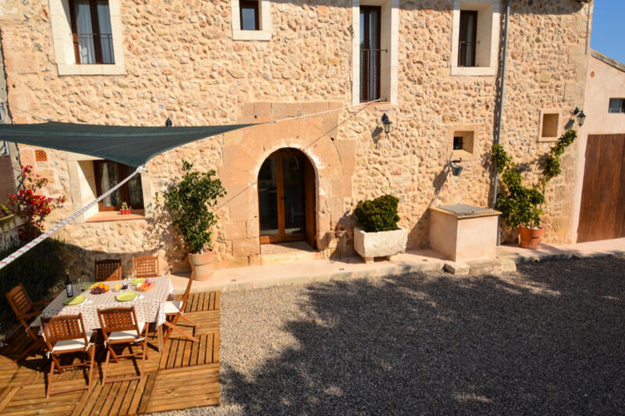 In the serene northern part of Mallorca, this charming holiday home offers a perfect blend of comfort and outdoor enjoyment for families or small groups. Imagine waking up to the gentle Mediterranean breeze, surrounded by the tranquil beauty of Santa Margarita, a village steeped in authentic Mallorcan charm. With cobblestone streets and traditional architecture nearby, this property invites you to experience the island's rich culture and idyllic landscapes. Whether you're seeking relaxation or adventure, this home is your gateway to unforgettable moments. \n\nInside, the house comfortably sleeps four guests with three cozy bedrooms upstairs. The fully equipped kitchen, complete with a large dining table, opens onto a welcoming living room furnished with plush seating and satellite TV. Two bathrooms, one on each floor, ensure convenience for all. Modern amenities like air conditioning and a pellet stove make this home suitable for year-round stays, offering both cool comfort in summer and warmth during the cooler months. \n\nStep outside to discover a delightful outdoor space designed for leisure and fun. The fenced swimming pool, measuring 3x5 meters, is perfect for refreshing dips, while the play area with swings, a ping-pong table, and toys keeps everyone entertained. Relax on the sun loungers, enjoy meals at the barbecue, or unwind with a book in the comfortable outdoor seating area. This property truly caters to all ages, making it an ideal retreat for families. \n\nLocated near Santa Margarita, you’ll find yourself just a short drive from pristine beaches and local culinary gems. Explore the surrounding countryside, indulge in fresh Mediterranean flavors, or simply soak up the sun. With its blend of charm, comfort, and proximity to Mallorca’s highlights, this property promises a holiday filled with relaxation and discovery.