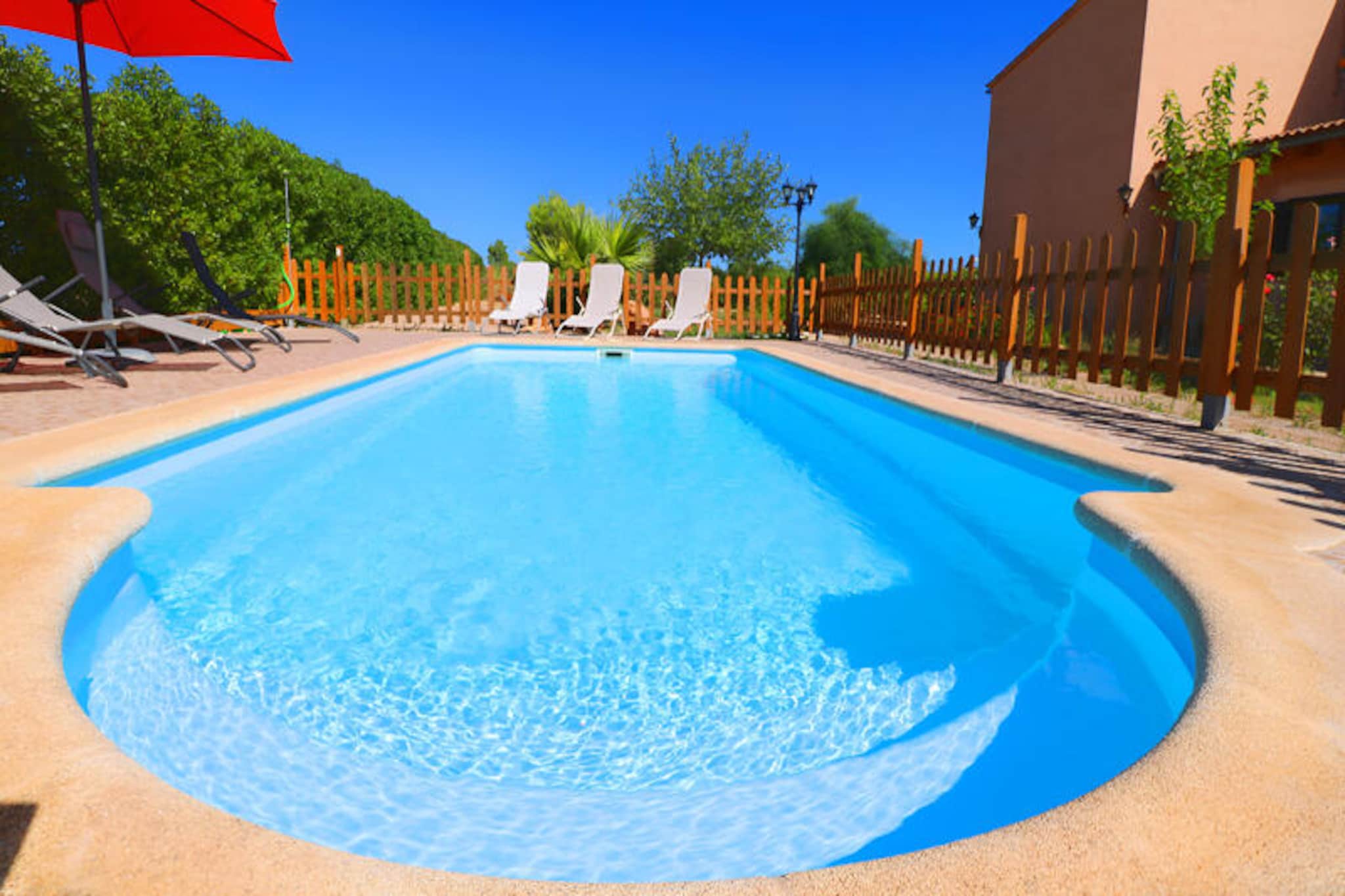 Amidst the serene countryside of Mallorca, this charming farmhouse invites you to experience the perfect blend of rustic charm and modern comfort. Surrounded by lush fields and just a short drive from the island’s most stunning beaches, Cala Llombards and Cala Santanyí, this property offers a tranquil retreat for families and groups seeking relaxation and adventure. Imagine waking up to the gentle sounds of nature, enjoying breakfast in the garden, and planning a day filled with exploration or poolside leisure.
The farmhouse spans 170 square meters and accommodates up to eight guests, ensuring ample space for everyone. The open-plan living and dining area is thoughtfully designed with cozy sofas, satellite TV, a DVD player, Wi-Fi, and air conditioning for year-round comfort. The fully equipped modern kitchen is perfect for preparing meals to enjoy at the large dining table or outdoors in the barbecue area. With four bedrooms featuring twin beds and two bathrooms, the layout is ideal for families or groups of friends. The fenced swimming pool, complete with child safety features, adds an extra layer of peace of mind for parents.
Located between the villages of Campos and Santanyí, the farmhouse is perfectly situated for exploring Mallorca’s authentic charm. Stroll through traditional streets, savor local delicacies, or venture to nearby beaches for sun-soaked days. The area also offers cycling routes, hiking trails, and cultural attractions, ensuring a diverse range of activities for all ages.
Whether you’re seeking a peaceful escape or an active holiday, this delightful property promises unforgettable memories in the heart of Mallorca’s countryside.