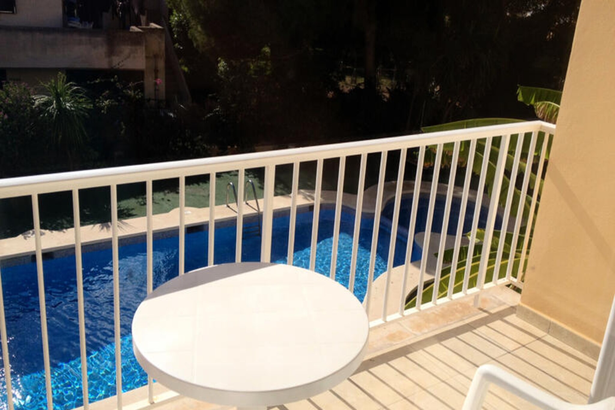 In the heart of Son Baulé, Can Picafort, this charming first-floor apartment invites you to experience the vibrant energy of Mallorca. Just 200 meters from the golden sandy beach, you’ll wake up to the gentle sound of waves and the promise of sun-soaked days. Whether you’re seeking relaxation or adventure, this coastal gem offers the perfect setting to create lasting memories. Stroll through the lively streets, discover local shops, and savor Mediterranean flavors at nearby restaurants. Can Picafort’s unique blend of natural beauty and cultural charm makes it a destination to remember. \n\nStep inside this modern 48 m² apartment and feel instantly at home. The thoughtfully designed space includes a cozy bedroom with two single beds and a sofa bed in the living room, accommodating up to four guests. The open-plan kitchen is equipped with everything you need to prepare delicious meals, while the living/dining room provides a welcoming area to unwind. With amenities like Wi-Fi, TV, and a music system, your comfort is assured. The balcony overlooking the pool is perfect for enjoying meals al fresco, adding a touch of serenity to your stay. \n\nThe residence features a shared 4x8m swimming pool, ideal for refreshing dips after a day exploring the island. Nearby, you’ll find endless opportunities for shopping, dining, and activities, ensuring every moment is filled with excitement. From water sports to cultural excursions, Can Picafort caters to every traveler’s desires. \n\nChoose this apartment as your base for an unforgettable Mallorcan getaway. With its unbeatable location, modern comforts, and access to the best of Can Picafort, it’s the perfect retreat for couples, families, or friends seeking the ultimate island escape.