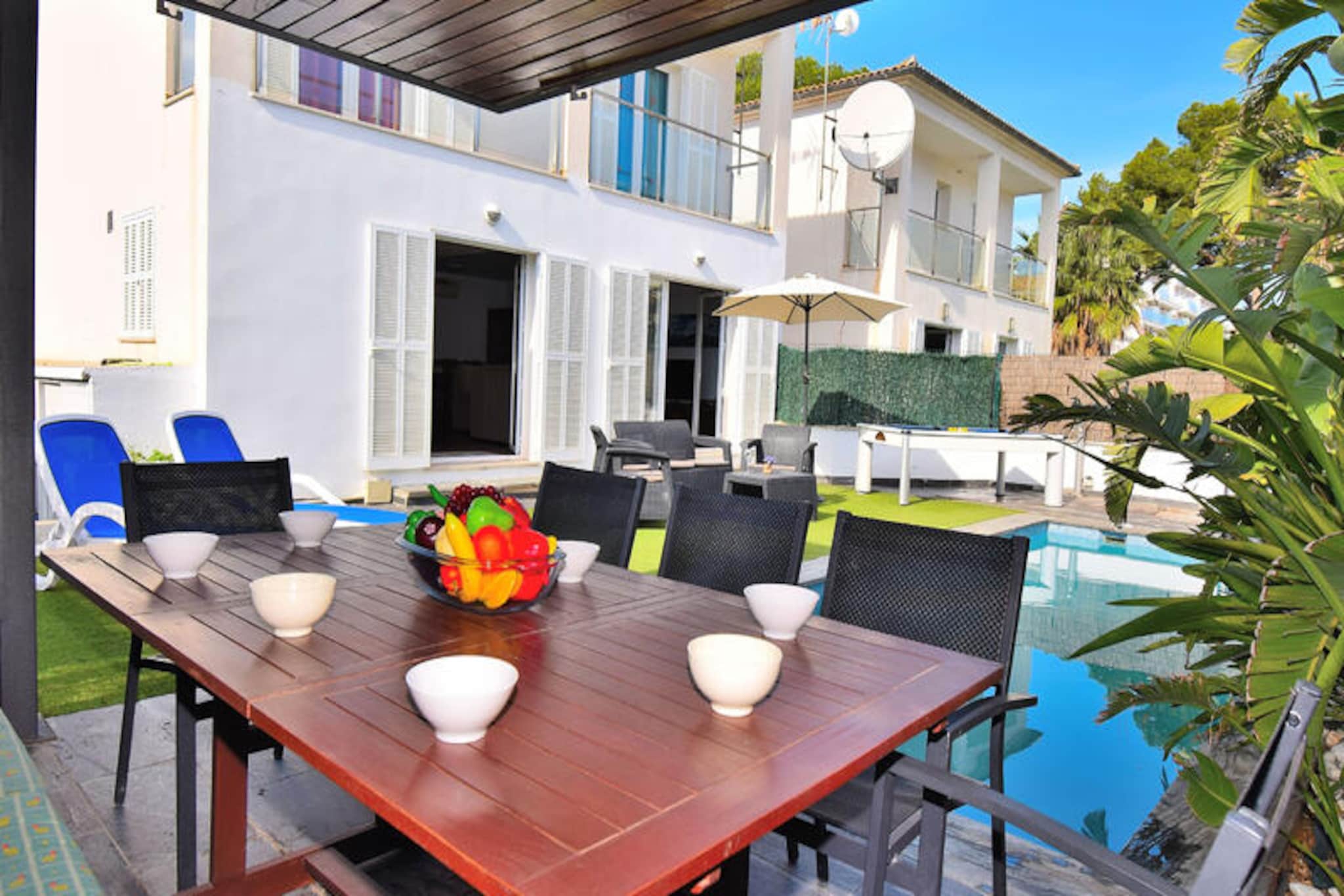 A few steps from the golden sands of Playa de Muro, this stunning terraced house offers the perfect retreat for families and friends seeking a serene coastal escape. Imagine waking up to the sound of gentle waves and enjoying your morning coffee by your private pool, surrounded by the lush Mediterranean ambiance of Mallorca. With its blend of modern comforts and charming outdoor spaces, this property promises an unforgettable holiday experience. \n\nInside, the house comfortably accommodates up to seven guests. The ground floor features a cozy bedroom with two single beds and a convenient bathroom with a shower. Upstairs, you’ll find three additional bedrooms, including one with a double bed and two with twin beds, as well as a bathroom with a bathtub. The open-plan kitchen, fully equipped for all your culinary needs, flows seamlessly into the living and dining area, where two plush sofas and a large dining table invite relaxation and shared meals. The entire house is fully air-conditioned, ensuring comfort throughout your stay. \n\nStep outside to discover a delightful private oasis. The 3x5 meter swimming pool is perfect for cooling off under the Mallorcan sun, while the sun loungers and barbecue area invite leisurely afternoons and al fresco dining. A covered porch with a dining table sets the stage for memorable evenings with loved ones. For added fun, enjoy a game of pool or ping-pong in the outdoor games area. \n\nLocated just 400 meters from Muro Beach, you’ll have easy access to a water sports school and the stunning s'Albufera Natural Park, ideal for nature lovers and adventure seekers. The vibrant local area offers a variety of dining options, shops, and entertainment, ensuring there’s something for everyone. Whether you’re exploring the pristine coastline, indulging in local cuisine, or simply unwinding by the pool, this property is your gateway to a perfect Mediterranean getaway.