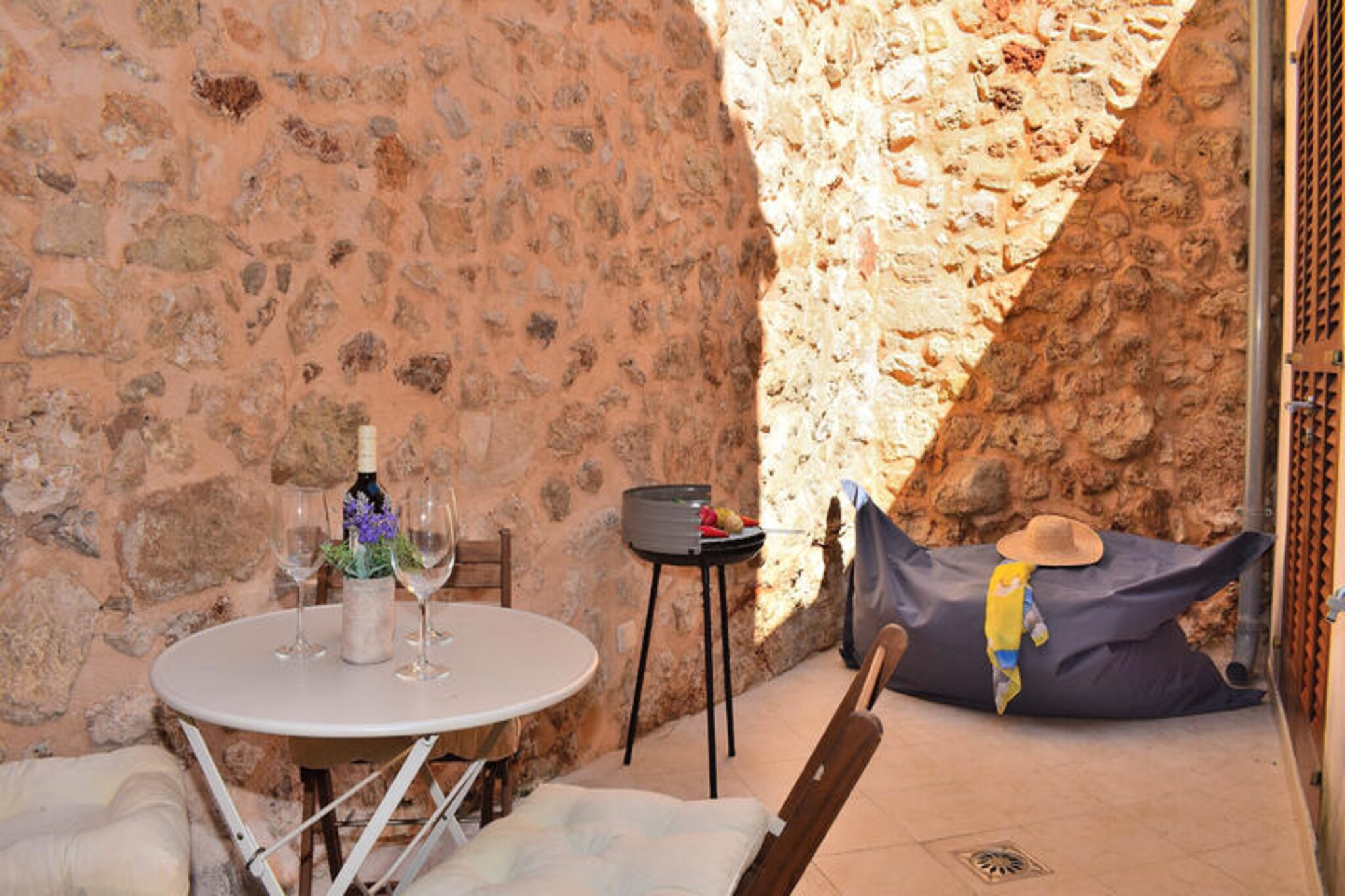 Amid the serene streets of Muro, this beautifully restored house offers a perfect blend of comfort and Mallorcan charm. With its three floors, the property invites you to experience the authentic Mediterranean lifestyle in a peaceful village setting surrounded by lush countryside. Whether you’re enjoying the sunlit patio or exploring the cobbled streets nearby, this home provides a tranquil retreat for a memorable getaway.
The house accommodates up to three guests and is thoughtfully designed across three levels. On the ground floor, a spacious living room welcomes you alongside a fully equipped kitchen that leads to a delightful interior patio, perfect for relaxing or dining al fresco. Upstairs, two air-conditioned bedrooms with double beds promise restful nights, complemented by a modern bathroom with a shower. The basement adds versatility with a cozy sofa bed and a play area, making it ideal for families or small groups. Every corner of the house reflects meticulous care and attention to detail, ensuring a comfortable stay.
Muro’s prime location places you close to some of Mallorca’s most stunning beaches and cultural attractions. Spend your days basking in the sun on golden sands or savoring local delicacies at nearby restaurants. The village itself enchants with its traditional architecture and vibrant local culture, offering a glimpse into the island’s rich heritage.
Whether you’re seeking relaxation or exploration, this house in Muro is your gateway to the best of Mallorca. Let its charm and comfort inspire unforgettable memories on your Mediterranean escape.