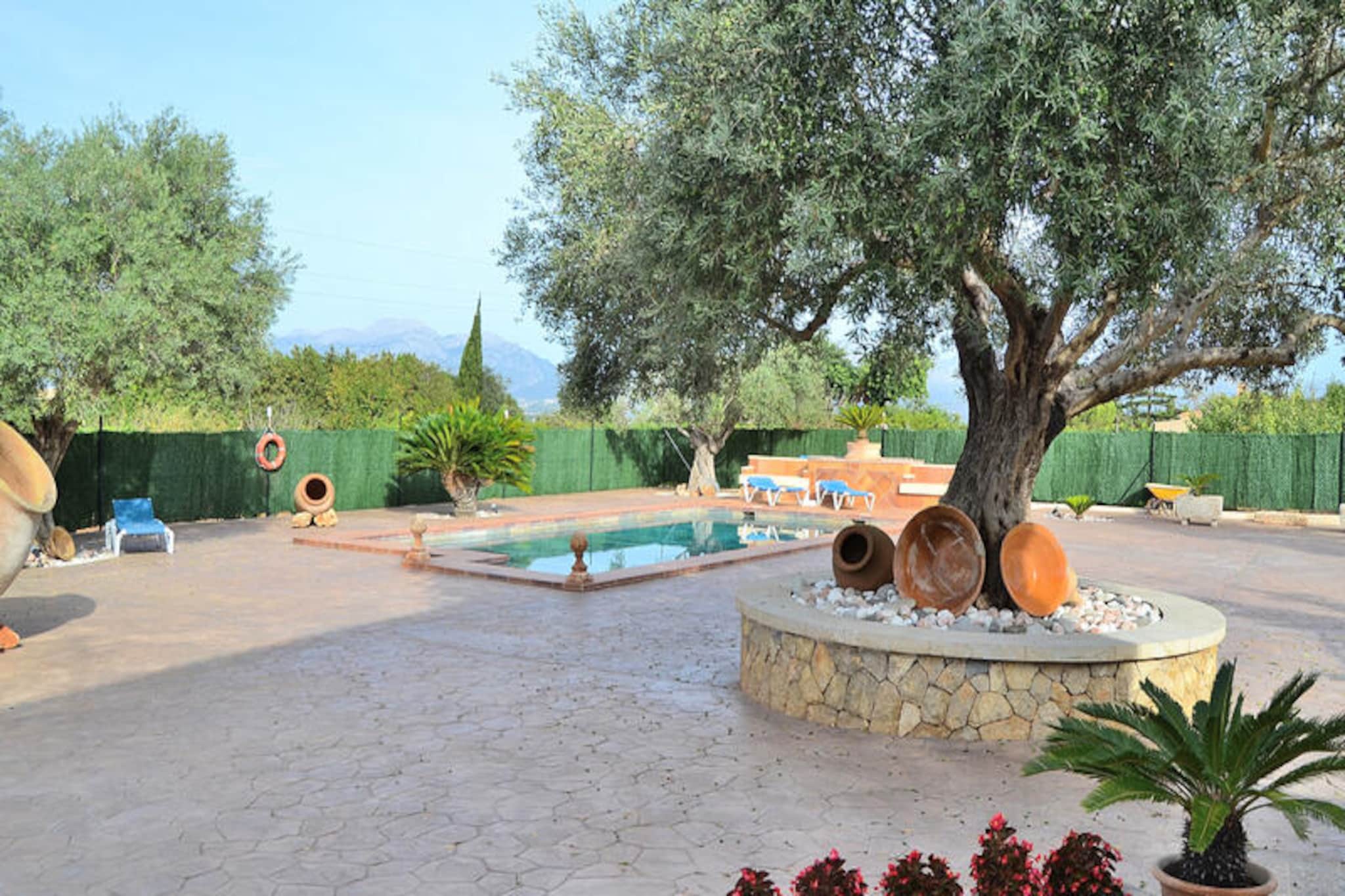 Amid the serene countryside of Mallorca, this charming farmhouse in Muro invites you to experience the perfect blend of rustic charm and modern comfort. Just a short walk from the village center, where cobbled streets and authentic Mallorcan architecture create a timeless atmosphere, this property is a haven for relaxation and discovery. Whether you’re sipping coffee on the terrace or exploring the nearby beaches of Muro and Can Picafort, every moment feels like a celebration of Mediterranean beauty. \n\nThe house accommodates up to four guests and is thoughtfully divided across two floors. On the ground floor, you’ll find a fully equipped kitchen ready for culinary adventures, a cozy living room with a fireplace for year-round enjoyment, and a bathroom. Upstairs, two inviting bedrooms and an additional bathroom ensure restful nights. With air conditioning, Wi-Fi, and satellite TV, your stay is as comfortable as it is picturesque. \n\nStep outside to the expansive garden and terrace, where the island’s sunny climate beckons. Lounge by the private pool, fire up the barbecue, or simply unwind on the sun loungers surrounded by lush greenery and mountain views. The outdoor space is perfect for creating unforgettable memories with family or friends. \n\nLocated just 10 minutes from pristine beaches and immersed in the charm of Muro, this farmhouse offers a unique escape into the heart of Mallorca. Whether you’re seeking tranquility, adventure, or a taste of local culture, this property is your gateway to an unforgettable island experience.