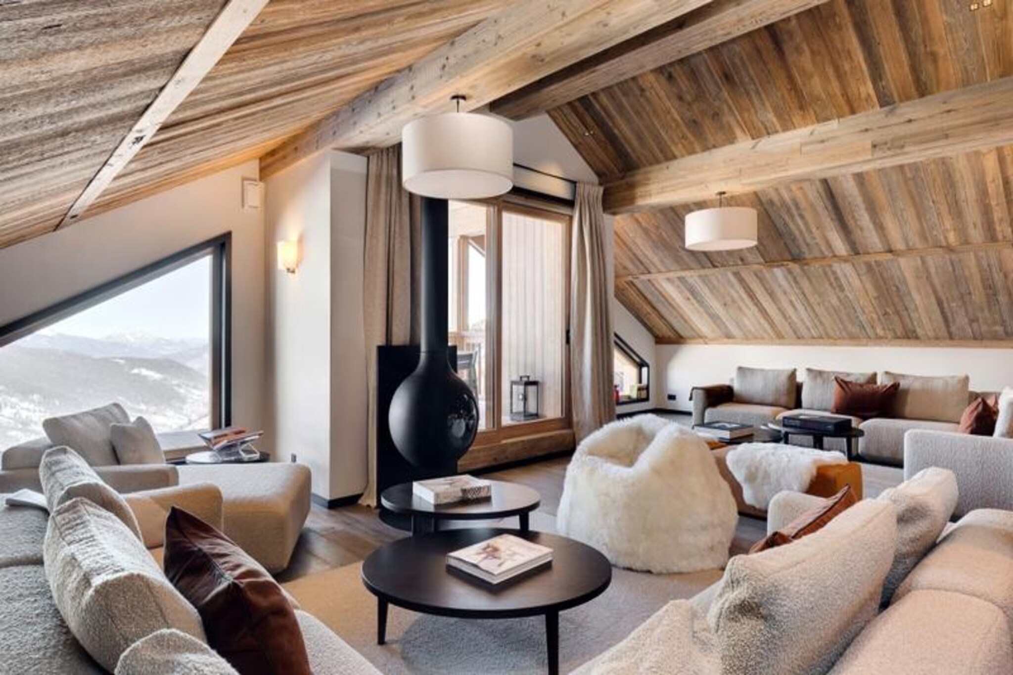 High above the charming village of Méribel, this luxurious penthouse apartment in the Antarès residence offers an unparalleled alpine retreat. With direct ski-in/ski-out access to the world-renowned 3 Valleys, your adventure begins the moment you step outside. Imagine waking up to panoramic mountain views from your private balcony, breathing in the crisp alpine air, and heading straight onto the pristine slopes of the largest ski area in the world. This is where elegance meets convenience, creating the perfect setting for an unforgettable holiday. 
 
 Spanning an impressive 270m², this duplex accommodates up to 15 guests across seven beautifully designed bedrooms, each with its own en-suite bathroom. The interiors blend contemporary sophistication with chalet-style warmth, featuring plush furnishings, natural wood accents, and large windows that flood the space with light. The common areas are equally inviting, offering a spacious living room for cozy evenings, a fully equipped kitchen for gourmet meals, and access to luxurious amenities such as an indoor pool, spa with sauna and hammam, fitness room, and even a dedicated kids' area. Every detail has been carefully curated to ensure comfort and relaxation. 
 
 The Rond-Point des Pistes area is a skier’s paradise, offering sunny slopes and easy access to restaurants and shops nearby. Avoid the morning rush at Chaudanne and enjoy the convenience of the free shuttle service that connects you effortlessly to Méribel’s vibrant town center. Whether you’re exploring the slopes, indulging in local Savoyard cuisine, or simply soaking in the serene mountain atmosphere, this location offers the best of everything. 
 
 With additional services such as private chefs, ski pass delivery, and in-home massages, your stay will be as seamless as it is luxurious. Perfect for families or groups, this penthouse is more than just a place to stay—it’s an experience to cherish.