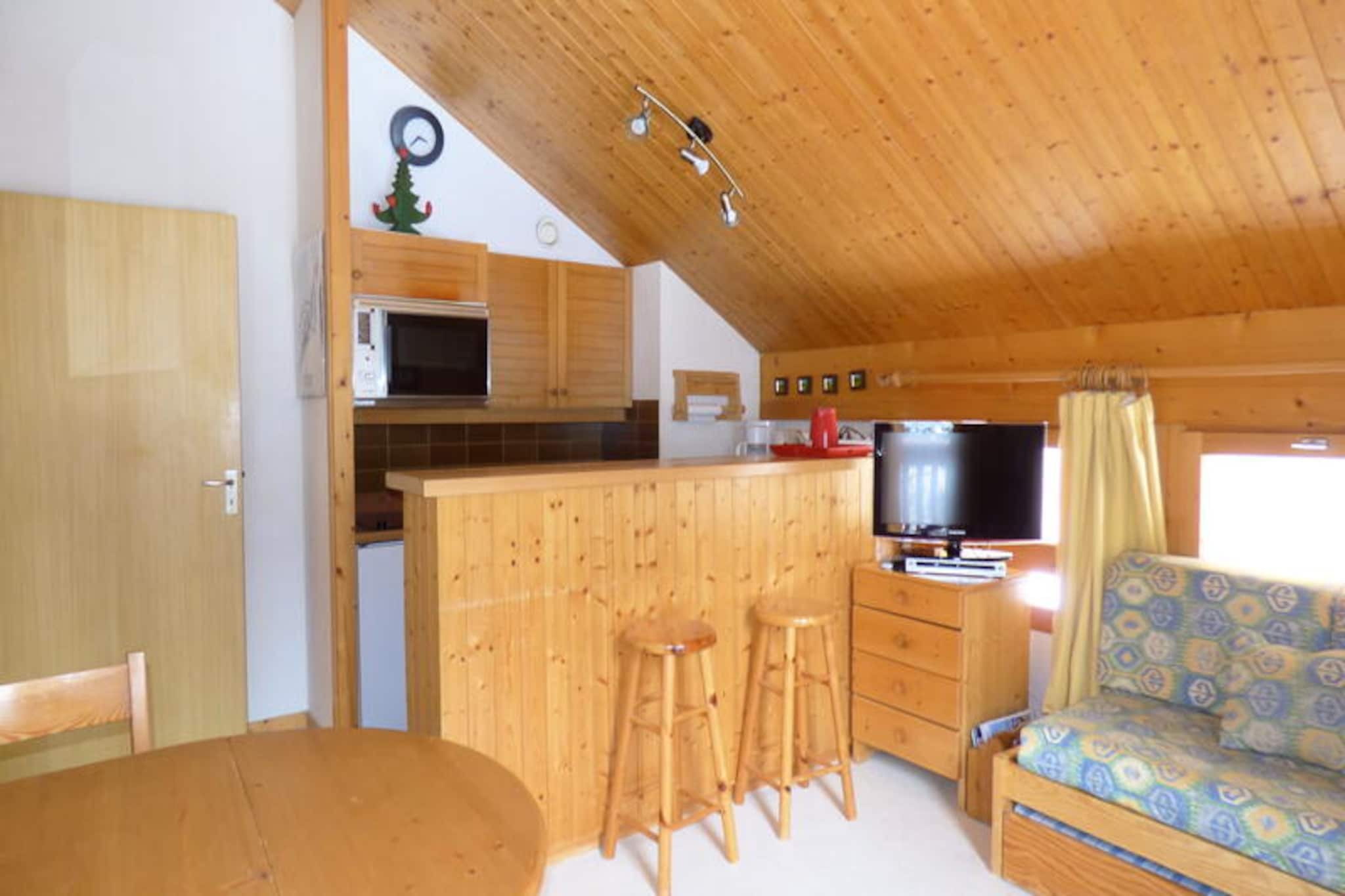 Surrounded by the serene beauty of the Altiport district in Méribel, this charming alpine apartment offers a tranquil retreat at the foot of the slopes. Imagine waking up to the sight of snow-dusted fir trees from your north-facing balcony, breathing in the crisp mountain air, and stepping directly onto the pistes for a day of adventure. Whether you visit in winter for skiing or in summer for hiking, this location immerses you in the heart of the Alps, just 3 km from the lively center of Méribel and conveniently close to the shuttle stop for easy access to the entire valley.
This cozy 39 m² apartment is thoughtfully designed to accommodate up to four guests, making it ideal for families or small groups. The master bedroom features a comfortable double bed, while the second bedroom offers bunk beds perfect for children or friends. The carpeted walls in the bedrooms add a unique touch of warmth and comfort. The kitchen is fully equipped with electric hobs, an oven, a microwave, a dishwasher, and a refrigerator, ensuring you have everything needed to prepare hearty meals after a day on the slopes. Additional amenities include a television, a ski locker, and a bathroom with both a bathtub and a separate shower adjoining the master bedroom.
Nestled in a prime location, this residence places you within easy reach of Méribel’s renowned ski runs, charming eateries, and vibrant après-ski scene. In summer, explore the lush alpine trails, enjoy mountain biking, or simply soak in the breathtaking views of the surrounding peaks. With parking available in front of the residence and pet-friendly accommodations, this apartment ensures a hassle-free and welcoming stay.
Whether you’re seeking an active holiday or a peaceful mountain escape, this Méribel retreat offers the perfect balance of comfort, convenience, and natural beauty.