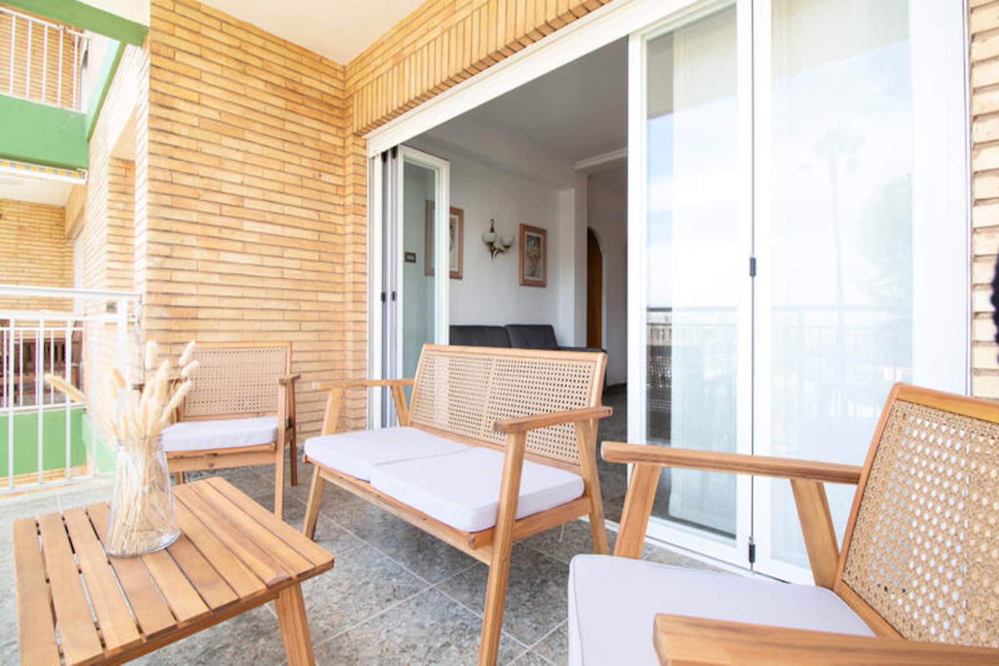 With its serene Mediterranean charm, this delightful apartment in Canet d'en Berenguer invites you to experience the perfect coastal escape. Just a short stroll from the golden sands of Playa de Canet d'en Berenguer, this property offers a harmonious blend of relaxation and convenience, making it an ideal retreat for families or small groups seeking a tranquil seaside holiday. Wake up to the soothing sounds of the sea and enjoy your morning coffee on the terrace while overlooking the lush gardens and sparkling waters beyond. 
 
 Spanning 94 m², this fully equipped apartment features three comfortable bedrooms, a spacious living area, and a modern kitchen with all the essentials, including a refrigerator, oven, microwave, and coffee maker. The property is thoughtfully designed with amenities such as Wi-Fi, air circulation fans, a washing machine, and a barbecue for al fresco dining. Guests can also enjoy access to a communal swimming pool, tennis and paddle courts, and a children’s play area, ensuring entertainment for all ages. 
 
 The location is unbeatable, with the beach just 250 meters away and a variety of local attractions within walking distance, including parks, restaurants, and charming cafés. Explore the nearby town of Sagunto, rich in history and culture, or venture further to discover the natural beauty of Sierra Calderona Natural Park and the tranquil Estanys d'Almenara lake. For thrill-seekers, PortAventura Park is a manageable drive away, offering a day of excitement for the whole family. 
 
 Whether you’re seeking sun-soaked days on the beach, leisurely evenings in the garden, or adventures exploring the Valencian coast, this apartment provides the perfect base for an unforgettable holiday.