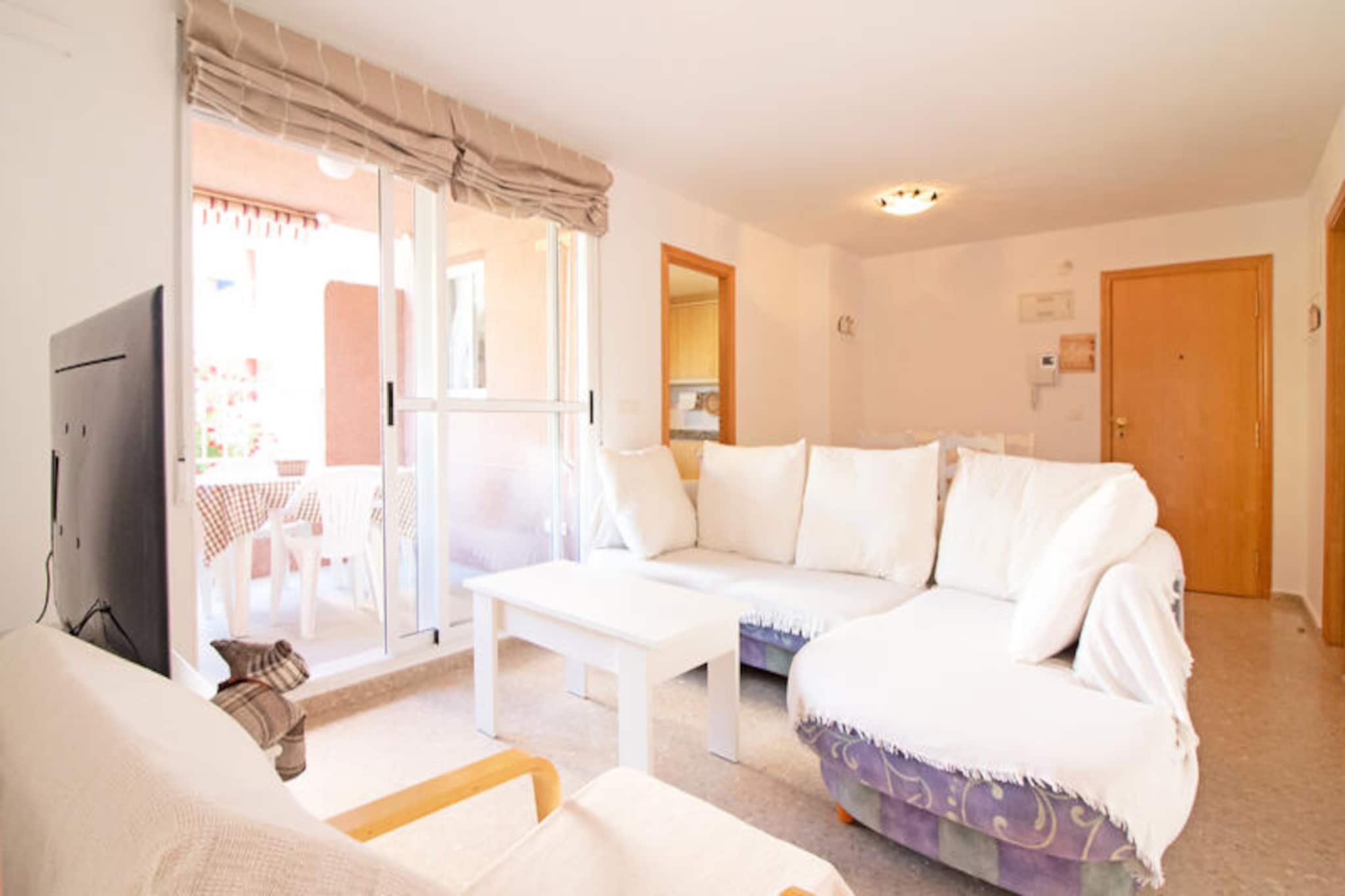 Imagine waking up to the gentle sound of waves and the golden glow of the Mediterranean sun. This delightful apartment in the Brezo Nova Canet development offers the perfect retreat for families or friends seeking a memorable beachside holiday. Located near the award-winning Canet d'en Berenguer beach, consistently voted the best in Spain, this property invites you to experience the charm of soft sands, crystal-clear waters, and a vibrant coastal atmosphere. Whether you're lounging by the communal pool or enjoying a morning coffee on your private terrace overlooking the lush development, every moment here feels like a slice of paradise. \n\nThe apartment features two comfortable bedrooms, a modern bathroom, and a fully equipped kitchen, ensuring a cozy and convenient stay. The terrace provides a serene view of the development, while the spacious living area is perfect for relaxing after a day of exploring. On-site amenities include swimming pools, children’s playgrounds, and tennis and paddle courts, offering entertainment for all ages. With its thoughtful design and welcoming ambiance, this apartment truly feels like a home away from home. \n\nStep outside and discover the beauty of Canet d'en Berenguer beach, stretching over 2,100 meters of fine sand and accessible for all, including those with reduced mobility. The town organizes free activities such as yoga, Pilates, water sports, and open-air cinema, ensuring endless fun for visitors. Nearby parks, restaurants, and supermarkets add to the convenience, making it easy to immerse yourself in the local culture and cuisine. \n\nWhether you're seeking relaxation or adventure, this apartment offers the ideal base to create unforgettable memories on Spain's stunning Mediterranean coast.