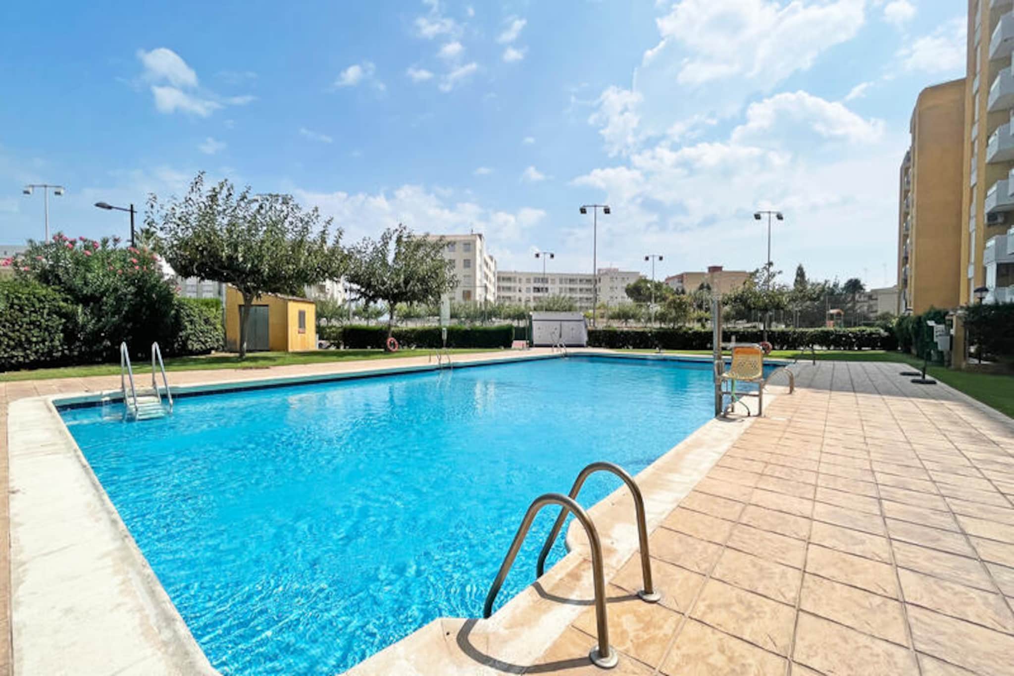 In the charming coastal town of Canet d'en Berenguer, this delightful apartment offers a serene retreat just moments from the Mediterranean Sea. Imagine waking up to the gentle sea breeze and spending your days exploring golden sandy beaches, indulging in local cuisine, or simply relaxing by the shared swimming pool. Whether you're seeking a romantic getaway or a family escape, this property provides the perfect setting for unforgettable memories under the Spanish sun. 
 
 The apartment, thoughtfully designed for up to four guests, boasts a cozy bedroom and a bright, open-plan living area. With 45 m² of space, it features modern amenities such as air conditioning, Wi-Fi, and a heat pump for year-round comfort. The well-equipped kitchen, complete with a ceramic hob, refrigerator, oven, and coffee maker, invites you to prepare delicious meals to enjoy on the private terrace or balcony. Additional conveniences include a washing machine, iron, mosquito nets, and two fans, ensuring a comfortable and hassle-free stay. Families will appreciate the children's play area and access to a tennis court, while on-site outdoor parking adds to the ease of your visit.
 
 Located in a vibrant area, the apartment is surrounded by a variety of attractions and essential facilities. Stroll to nearby shops, restaurants, and cafes, or venture further to discover the rich history and culture of Valencia, just a short drive away. The region also offers opportunities for water sports, hiking, and cycling, making it an ideal destination for active travelers. 
 
 Whether you're drawn by the allure of the sea, the charm of the local community, or the promise of relaxation, this apartment in Canet d'en Berenguer is your gateway to an unforgettable Spanish holiday. Book now and let the Mediterranean lifestyle enchant you.