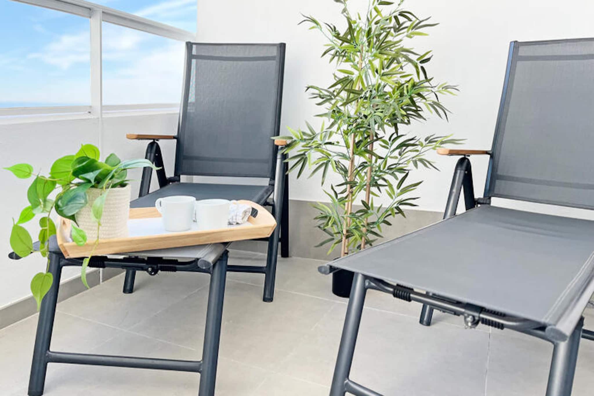 In the charming coastal town of Canet d'en Berenguer, this delightful apartment offers a serene retreat just moments from the Mediterranean's golden sands. With its modern amenities and thoughtful design, it’s the perfect getaway for families or small groups seeking both relaxation and adventure under the Spanish sun. Imagine waking up to the gentle sea breeze, enjoying your morning coffee on the private terrace, and planning a day filled with beachside fun or exploring the vibrant local culture. 
 
 Spanning 76 m², the apartment comfortably accommodates up to five guests across two cozy bedrooms. The open-plan kitchen, equipped with state-of-the-art induction hobs, a dishwasher, and all essential appliances, makes preparing meals a breeze. Relax in the air-conditioned living space, catch up on your favorite shows on the television, or stay connected with complimentary Wi-Fi. The property also boasts garden furniture, a washing machine, and even a hairdryer for added convenience. Families will appreciate the children’s play area, while sports enthusiasts can enjoy the paddle tennis court and shared swimming pool. Covered parking within the building ensures a hassle-free stay. 
 
 Just a short stroll away, you’ll find the pristine beaches of Canet d'en Berenguer, renowned for their crystal-clear waters and soft sands. The town itself is brimming with charm, offering a variety of restaurants, shops, and cultural attractions. For those seeking wellness, the on-site spa provides a tranquil escape. Whether you’re exploring nearby Valencia or simply soaking up the coastal ambiance, this apartment places you at the heart of it all. 
 
 Create unforgettable memories in this idyllic Spanish haven, where comfort meets convenience and every moment feels like a celebration of Mediterranean living.