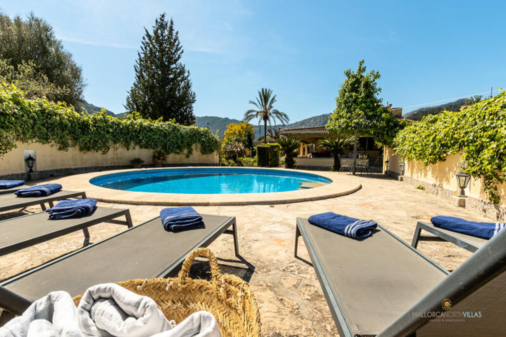 In the heart of Mallorca's serene countryside, La Sort Llarga invites you to experience the perfect blend of traditional charm and modern comfort. This delightful country house, nestled in the picturesque town of Pollença, offers a tranquil retreat for families or friends seeking a memorable Mediterranean escape. Surrounded by lush landscapes and just a short drive from pristine beaches, it’s an ideal base for relaxation and exploration.
Step inside this spacious 240 m² villa, all on one level, where rustic elegance meets contemporary convenience. The bright living and dining area, adorned with Mallorcan touches, is equipped with air conditioning and a Smart TV, creating a cozy space to unwind after a day of adventure. The fully equipped kitchen, complete with a dishwasher, electric oven, and reverse osmosis system for drinking water, ensures a seamless stay. The villa features three comfortable bedrooms, two with air conditioning and all with Smart TVs, and two bathrooms, including one with external access for added convenience.
Outdoors, the private round swimming pool, surrounded by nature, is perfect for cooling off under the Mediterranean sun. The large furnished terrace, complete with a barbecue, refrigerator, and relaxation area, sets the stage for unforgettable al fresco dining and long, leisurely evenings. Covered parking for two cars adds to the convenience.
Located in the charming village of Pollença, known for its historic streets, Mount Calvary, and vibrant local cuisine, La Sort Llarga is just a short drive from stunning beaches like Puerto Pollensa, Formentor, and Cala Sant Vicent. Whether you’re a cyclist, hiker, golfer, or simply a lover of nature and culture, this villa offers the perfect starting point for your Mallorcan adventure. Book your stay and create lasting memories in this idyllic retreat.
