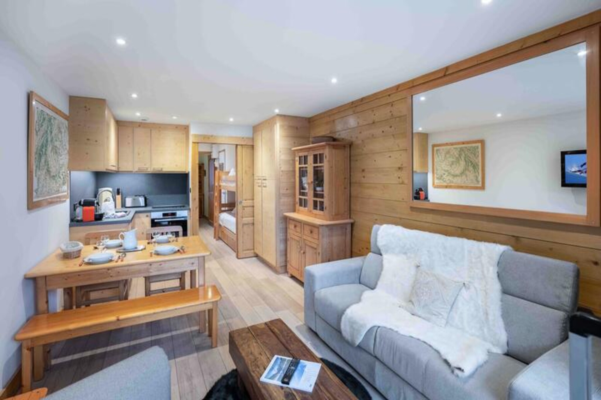 In the heart of the enchanting Méribel valley, this cozy apartment in the ERMITAGE residence offers an idyllic alpine retreat. Just steps away from the Doron slope, accessible via a charming footbridge, and surrounded by the vibrant energy of Méribel Centre, this property places you at the epicenter of mountain charm and convenience. Wake up to the crisp mountain air and enjoy effortless access to ski schools, après-ski bars, and gourmet restaurants, all within walking distance. Whether you're here for thrilling descents or serene mountain strolls, this location caters to every whim.
Apartment #27, located on the third floor, is thoughtfully designed to accommodate up to four guests. The warm and inviting living room opens onto a west-facing balcony, perfect for soaking in the golden hues of the setting sun. The open-plan kitchen is fully equipped with modern amenities, including a Nespresso machine, raclette grill, and fondue set, ensuring delightful evenings of culinary indulgence. A comfortable double bedroom and a sleeping alcove with bunk beds make this apartment ideal for families or small groups. With a separate bathroom and independent WC, every detail has been considered for your comfort.
Méribel Centre offers seamless connectivity with free shuttle buses and easy access to the Chaudanne snow front, where ski schools and children’s clubs await. After a day on the slopes, unwind in the lively après-ski scene or explore the charming boutiques nearby. For added convenience, the apartment includes a ski locker and covered parking.
Whether you're seeking adventure or relaxation, this alpine haven promises an unforgettable escape in the heart of the French Alps.