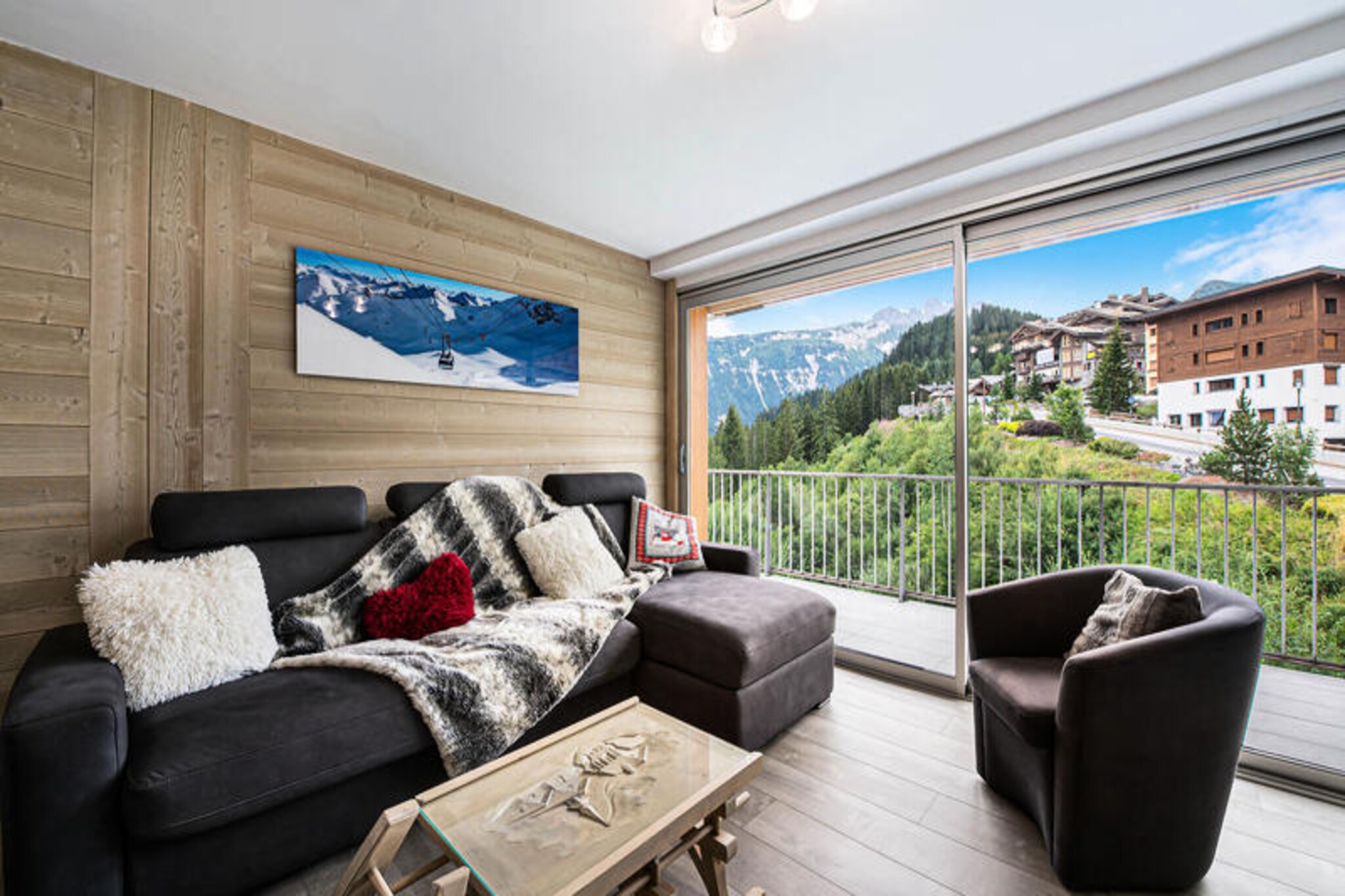 High above the picturesque valley of Courchevel Moriond, this beautifully renovated apartment offers a serene alpine escape with modern comforts and breathtaking mountain views. Situated on the second floor of the Le Doron residence, it welcomes you with its southwest-facing balcony, where sunsets paint the peaks in hues of gold and crimson. Whether you're here for the slopes or the summer trails, this cozy retreat is your perfect base for adventure and relaxation.
Inside, the 53m² space is thoughtfully designed to accommodate up to 6/7 guests. The open-plan living area features a fully equipped kitchen with an induction hob, combination microwave/oven, and a dishwasher, making it easy to prepare meals after a day of exploration. The living room boasts a comfortable sofa bed and a TV, while the dining area is perfect for sharing stories over a hearty meal. Two well-appointed bedrooms include a double bed and a set of bunk beds with three singles, ensuring ample space for families or groups. A modern shower room with a washer/dryer and a separate toilet add to the convenience.
Located at the entrance of Moriond, the apartment is just moments away from the vibrant village center, ski lifts, and local amenities. A ski locker and a reserved parking space in the nearby \