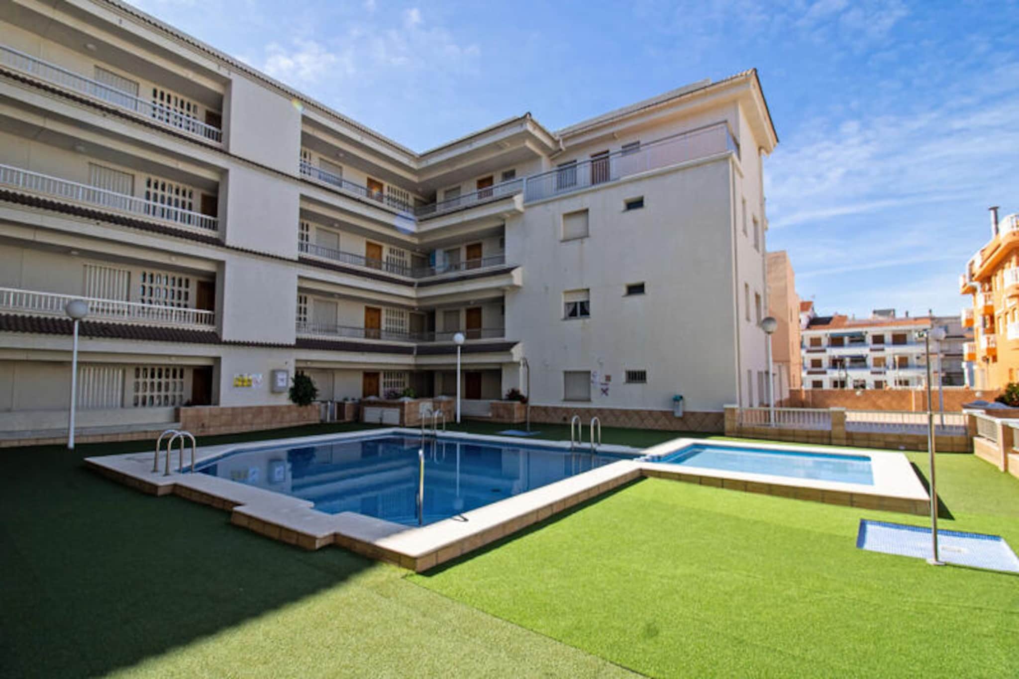 Imagine waking up to the soothing sound of waves and stepping onto a vast 55-square-meter terrace where the Mediterranean breeze greets you. This two-bedroom beachfront apartment in Cargador, nestled within the Irta Playa urbanization, offers a serene yet vibrant escape. With direct access to the golden sands and a lively promenade filled with bars, restaurants, and ice cream parlors, every moment here is a celebration of coastal living. The communal swimming pool adds an extra touch of relaxation, perfect for cooling off after a day in the sun.
Inside, the apartment spans 81 square meters, thoughtfully designed for comfort and convenience. The separate kitchen is fully equipped with modern appliances, including a ceramic hob, refrigerator, microwave, oven, freezer, washing machine, dishwasher, coffee maker, and toaster, making it easy to prepare meals for family or friends. The first bedroom features two single beds, a built-in wardrobe, and a ceiling fan, while the second bedroom offers a cozy double bed, wardrobe, and ceiling fan. A spacious bathroom with a bathtub ensures a refreshing retreat after a day of exploration. The living/dining room, complete with a comfortable sofa and TV, opens up to the expansive terrace, where partial sea views create the perfect backdrop for outdoor dining or simply soaking up the Mediterranean ambiance.
Beyond the apartment, the location is unbeatable. With supermarkets, local eateries, and entertainment just steps away, everything you need is at your fingertips. Whether you’re strolling along the beach, enjoying a refreshing dip in the pool, or savoring a sunset dinner on the terrace, this property promises an unforgettable coastal getaway. Ideal for families or couples seeking tranquility with the convenience of nearby amenities, this beachfront haven is your gateway to the best of the Costa del Azahar.