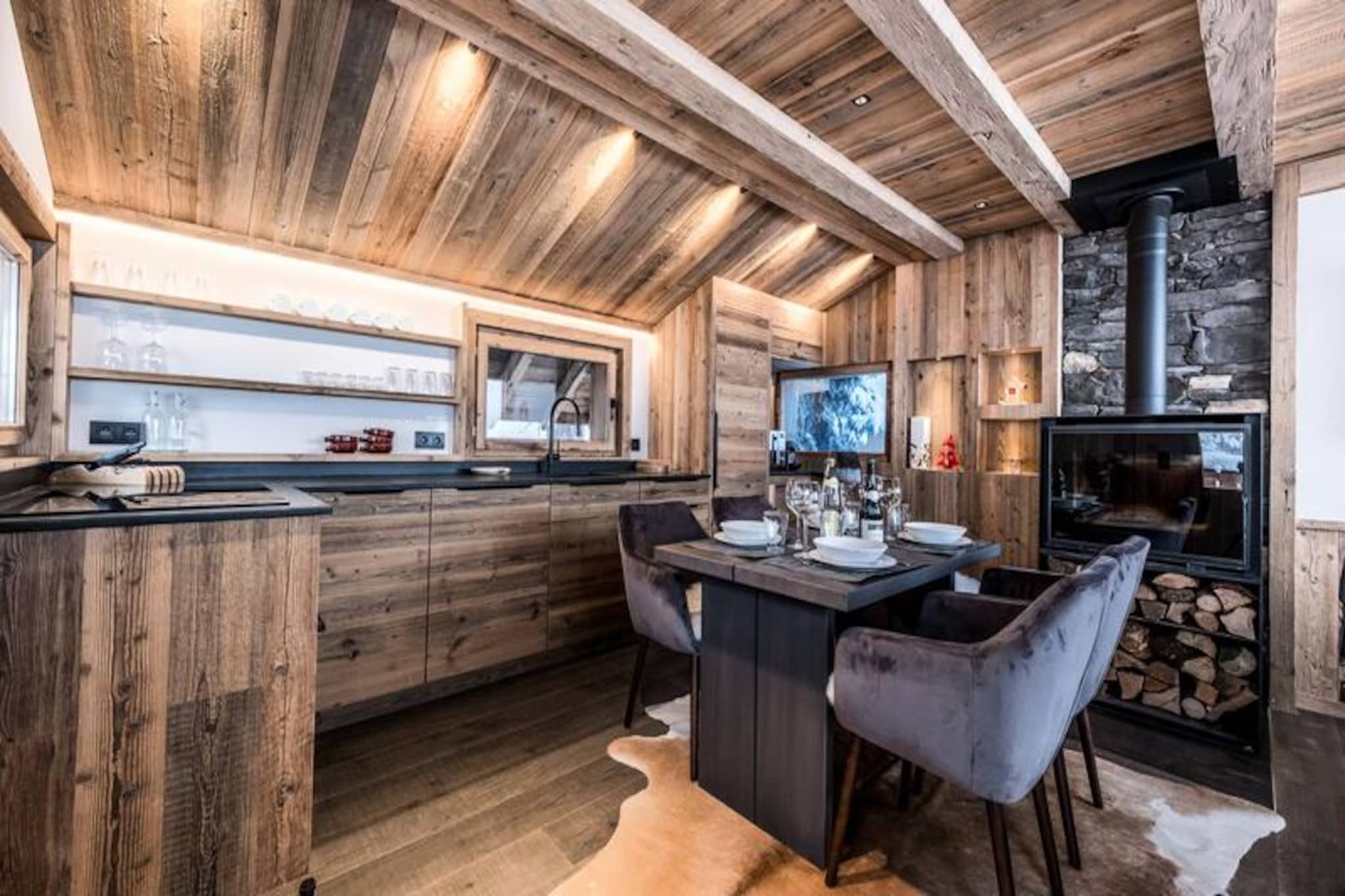 Amidst the serene charm of Les Mazots in Courchevel 1850, this delightful chalet invites you to experience the magic of the French Alps in a setting that blends rustic elegance with modern comfort. Imagine waking up to breathtaking mountain views, stepping onto your spacious terrace to breathe in the crisp alpine air, and planning a day of adventure or relaxation in one of the world’s most prestigious ski destinations. Whether you’re here for winter thrills or summer tranquility, this chalet offers a warm and welcoming retreat. \n\nSpanning three levels, the chalet accommodates up to five guests with thoughtfully designed spaces that exude mountain-style charm. The ground floor features a cozy double bedroom with en-suite shower room, a charming cabin with bunk beds, and a private sauna for ultimate relaxation. The first floor boasts an inviting living and dining area with a wood-burning stove, perfect for unwinding after a day on the slopes, alongside a fully equipped kitchen for preparing hearty meals. The mezzanine adds a touch of intimacy with its snug sleeping area. Modern amenities such as 5G internet, a boot dryer, and a ski rack ensure your stay is as convenient as it is comfortable.\n\nLocated close to the slopes and the vibrant resort center, you’ll find everything you need within easy reach—from ski lifts and trails to gourmet restaurants and boutique shops. In winter, enjoy personalized services including ski pass arrangements, equipment rentals, and concierge support, while summer brings opportunities for hiking, exploring, and soaking in the natural beauty of the region. \n\nWhether you’re seeking adventure or a peaceful escape, this chalet is your gateway to unforgettable memories in the heart of Courchevel 1850. Let the majestic Alps be the backdrop to your dream holiday.