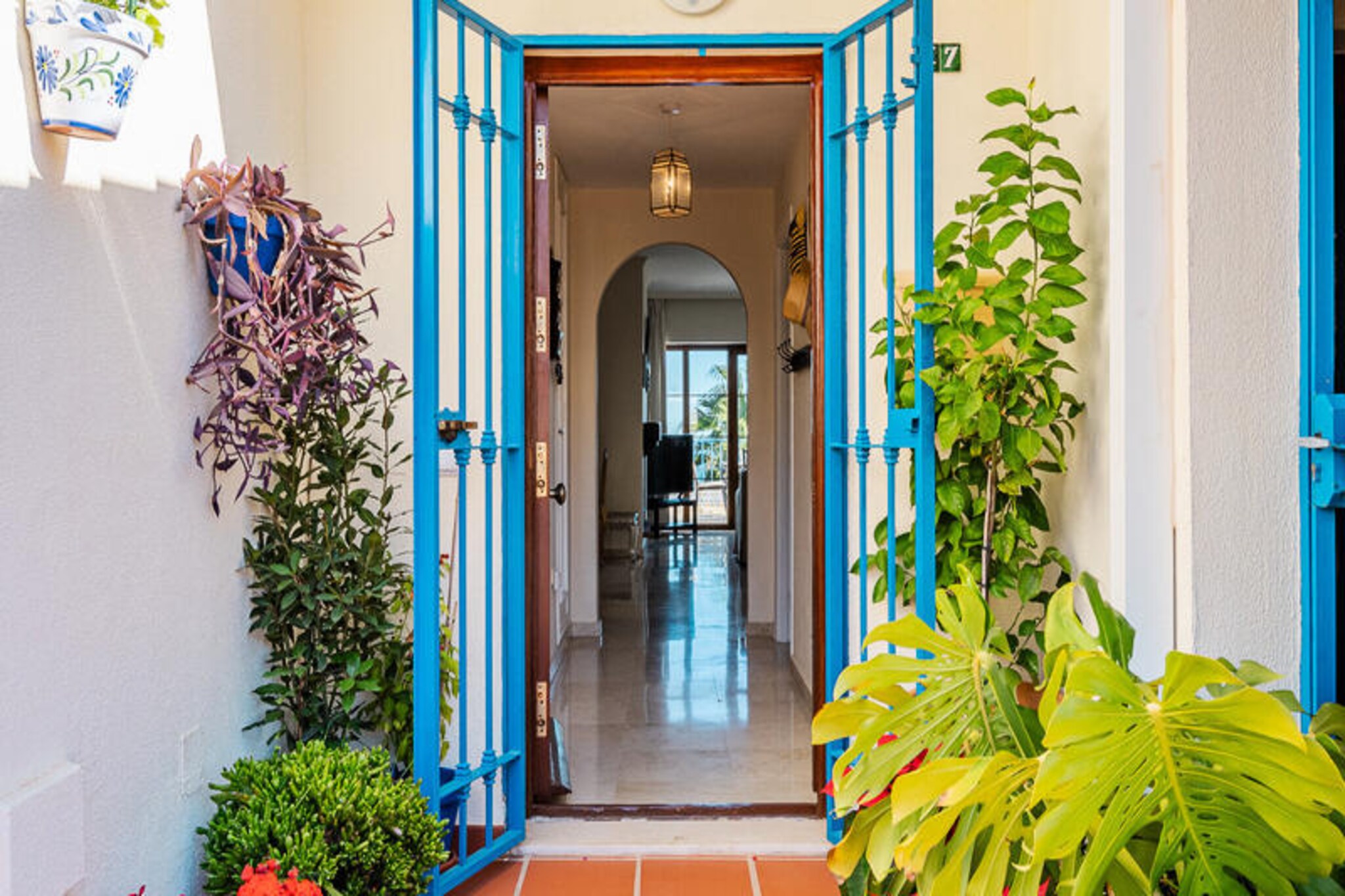 With sweeping views of the Mediterranean and the lush greens of Duquesa Golf Club, this spacious apartment in Manilva offers a serene escape for up to eight guests. Bathed in natural light, the 120 m² residence is perfectly situated on the first line of the golf course, blending coastal beauty with the charm of a residential complex. Whether you're waking up to the gentle sound of waves or enjoying the vibrant hues of a sunset from your terrace, every moment here feels like a retreat into tranquility. \n\nInside, the apartment boasts three comfortable bedrooms and a range of modern amenities designed for relaxation and convenience. The fully equipped kitchen features induction appliances, a dishwasher, and all the essentials for preparing family meals. Central heating, air conditioning, Wi-Fi, and a cozy fireplace ensure comfort year-round, while the communal swimming pool and nearby garage add to the ease of your stay. With garden furniture and a terrace, outdoor living is just as inviting as the interiors. \n\nLocated just 800 meters from Playa De Las Gaviotas, you can spend your days basking in the sun or exploring the charming town of San Luis De Sabinillas, only 2 kilometers away. Golf enthusiasts will appreciate the proximity to Duquesa Golf Club, while food lovers can savor local flavors at Kellys Bar, just 160 meters from the property. For added convenience, Mercadona supermarket is only 1 kilometer away, making it easy to stock up for your stay. \n\nWhether you're here for the beaches, golf, or simply to unwind, this apartment offers the perfect blend of comfort, location, and Mediterranean charm. Let the beauty of Manilva and the Costa del Sol inspire your next getaway.