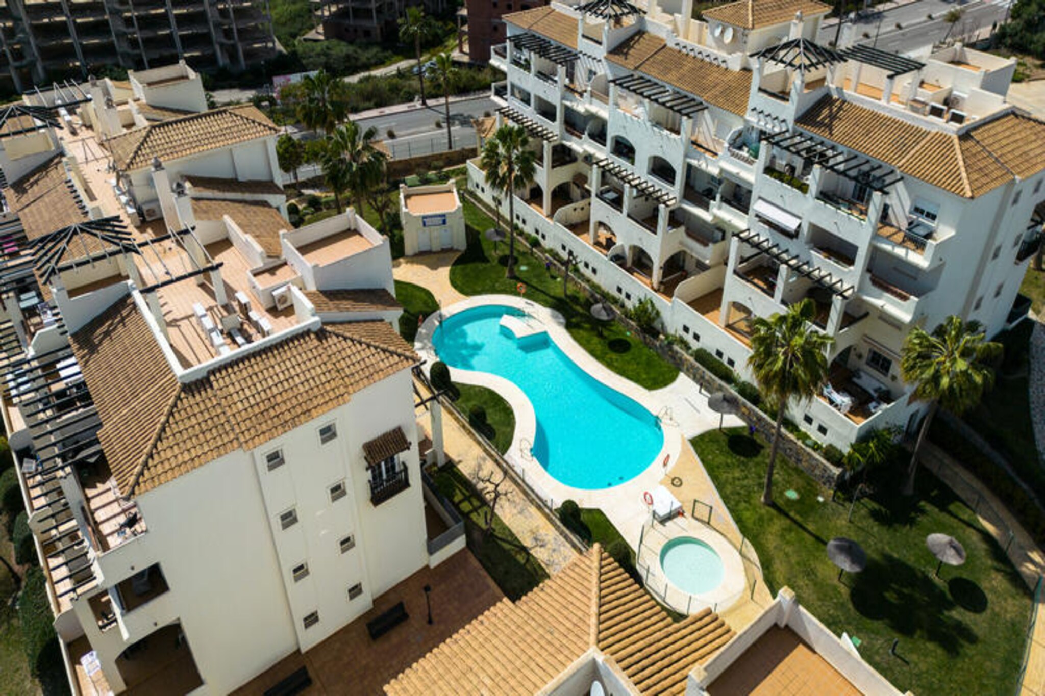 Amid the sun-drenched charm of San Luis de Sabanillas, this modern apartment offers a tranquil retreat for those seeking a blend of comfort and coastal allure. Imagine waking up to the gentle Mediterranean breeze, with the vibrant town and serene beaches just moments away. Whether you're here to relax or explore, this property sets the stage for unforgettable memories. \n\nSpanning 85 m², the apartment boasts two inviting bedrooms and accommodates up to six guests. Thoughtfully designed with convenience in mind, it features a private terrace perfect for morning coffee or evening cocktails, a lush garden with furniture for outdoor relaxation, and access to a shared swimming pool for refreshing dips. Inside, you'll find modern amenities including Wi-Fi, air conditioning, central heating, and a fully equipped kitchen with induction hobs, a dishwasher, and all the essentials for home-cooked meals. Additional touches like a washing machine, iron, and hairdryer ensure a hassle-free stay. \n\nThe location is ideal for exploring the Costa del Sol. Nearby, you'll discover stunning beaches, charming local eateries, and vibrant markets. For the active traveler, the paddle tennis court offers a fun way to stay fit, while the surrounding area invites you to enjoy scenic walks or cycling routes. Outdoor parking makes it easy to venture further afield to nearby attractions like Estepona or Marbella. \n\nWhether you're seeking a peaceful getaway or a base for adventure, this apartment in San Luis de Sabanillas offers the perfect balance of relaxation and excitement. Let the beauty of southern Spain captivate you as you unwind in this delightful coastal haven.