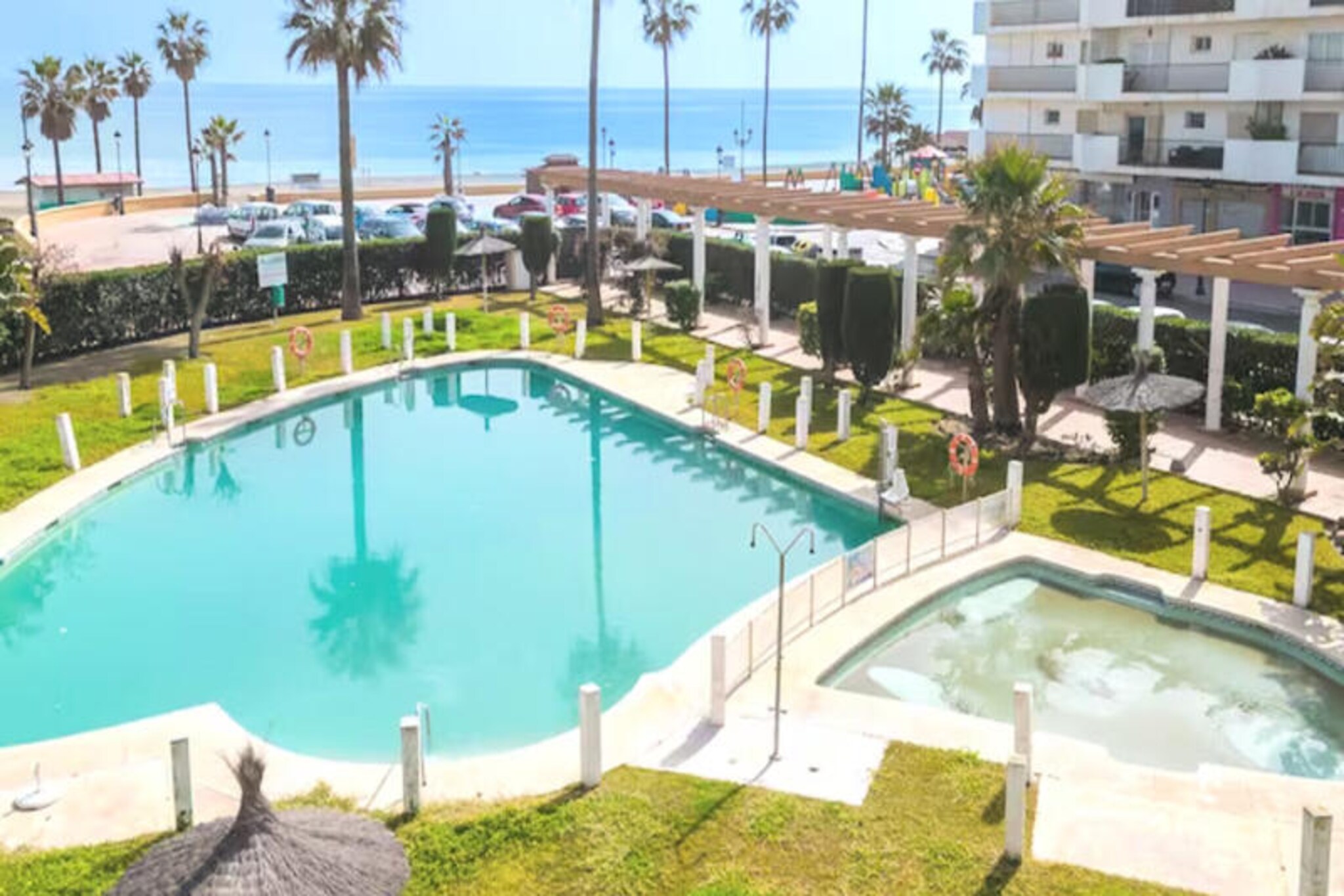 In the heart of San Luis de Sabinillas, where the Mediterranean breeze mingles with the vibrant charm of a coastal town, this delightful apartment offers a serene escape for up to four guests. Imagine waking up to the gentle sound of waves and stepping out onto your spacious 36 m² terrace to soak in the sun-drenched atmosphere. Whether you're here for a relaxing retreat or an active seaside adventure, this property invites you to experience the best of Andalusian living. \n\nInside, the apartment combines comfort and practicality with its well-appointed layout. The two cozy bedrooms provide a peaceful haven after a day of exploration, while the ceramic-cooktop kitchen is fully equipped with modern appliances, including a dishwasher, microwave, and coffee maker, ensuring all your culinary needs are met. Amenities such as air conditioning, Wi-Fi, satellite TV, and a washing machine add to the convenience, while the communal swimming pool offers a refreshing escape during warm afternoons. Outdoor parking nearby ensures hassle-free access throughout your stay. \n\nJust steps away, you'll find the sandy shores of Playa Sabinillas, perfect for sunbathing or a leisurely stroll. The town’s lively streets are dotted with charming cafés, restaurants like La Casita, and a well-stocked supermarket for your daily needs. Golf enthusiasts will appreciate the proximity to Duquesa Golf Club, just 2 km away, while Malaga Airport is conveniently located 100 km from the property, making travel seamless. \n\nWhether you're savoring local delicacies, exploring the picturesque coastline, or simply unwinding on your private terrace, this apartment is your gateway to the enchanting beauty of Costa del Sol. Let the warmth of San Luis de Sabinillas create unforgettable memories for your next getaway.