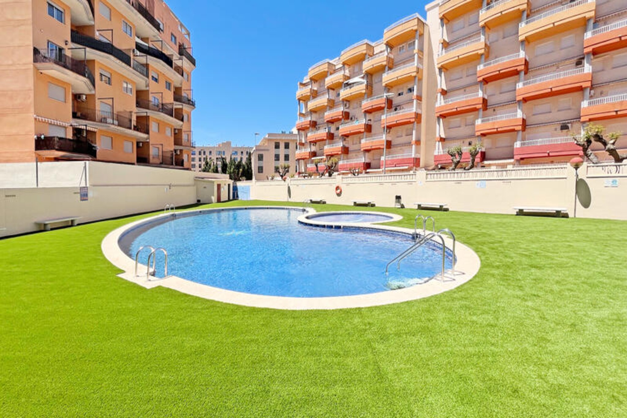 In the heart of Canet d'en Berenguer, where the Mediterranean breeze meets golden sands, this modern apartment offers the perfect retreat for a relaxing getaway. Just a short stroll from the pristine beach, you’ll find yourself surrounded by the charm of coastal Spain, with its vibrant atmosphere and stunning sea views. Whether you’re seeking a tranquil escape or an active holiday, this location has it all.
Spanning 205 m², the apartment comfortably accommodates up to four guests across two well-appointed bedrooms. The spacious interior is complemented by a 70 m² terrace, ideal for al fresco dining or soaking up the Spanish sun. Equipped with modern amenities such as air conditioning, Wi-Fi, a washing machine, dryer, and mosquito nets, every detail has been considered for your comfort. The American-style kitchen, complete with a ceramic hob, refrigerator, oven, and coffee maker, ensures you can prepare meals with ease. A shared swimming pool, including a children’s pool, adds to the appeal, offering a refreshing escape on warm days.
Canet d'en Berenguer is a destination that blends natural beauty with convenience. The nearby beach is perfect for sunbathing or enjoying water sports, while local restaurants and shops provide a taste of authentic Spanish culture. For those looking to explore, the vibrant city of Valencia is just a short drive away, offering historic landmarks, world-class dining, and cultural attractions.
Whether you’re traveling as a family, a couple, or with friends, this apartment is your gateway to the best of the Mediterranean. Relax, unwind, and create unforgettable memories in this idyllic coastal haven.
