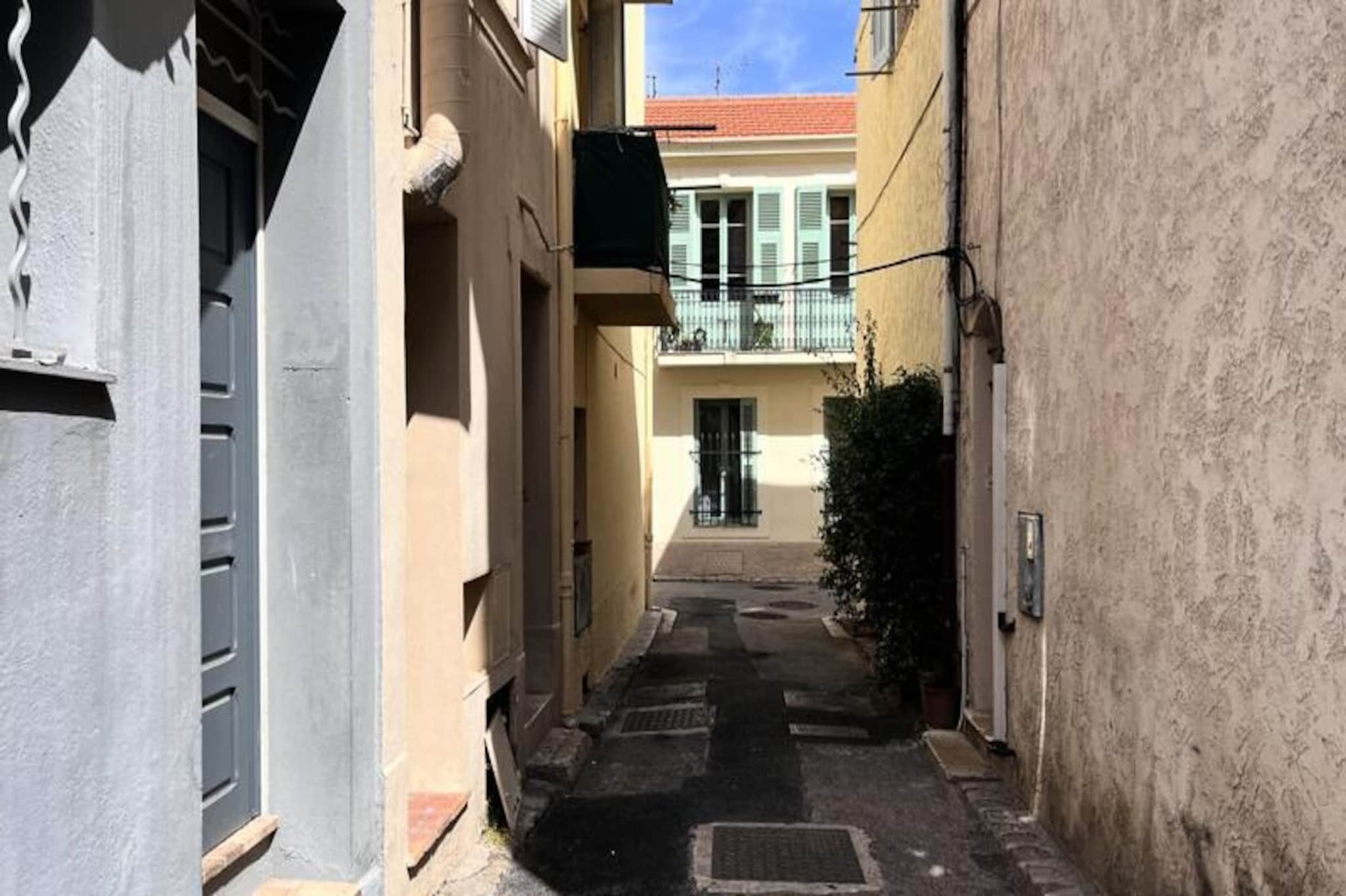 Step into the enchanting streets of Antibes’ old town and discover this charming studio apartment, perfectly situated on Place Amiral Barnaud. With its cozy mezzanine layout and thoughtful amenities, this air-conditioned retreat is ideal for couples or small families seeking a memorable getaway. Immerse yourself in the vibrant Provençal atmosphere, where history and modern comfort blend seamlessly. From the moment you arrive, you’ll be captivated by the picturesque pedestrian streets, bustling markets, and the timeless allure of this Mediterranean gem. \n\nInside, the apartment offers a warm and inviting space designed for relaxation. The main living area features a small kitchenette equipped with essential appliances, including a stovetop, oven, microwave, and refrigerator, making it easy to prepare meals with fresh local ingredients. The dining area, with seating for two, is perfect for intimate meals, while the sofa bed provides additional sleeping options. Upstairs on the mezzanine, a comfortable double bed awaits, ensuring restful nights after days filled with exploration. The apartment also includes Wi-Fi and air conditioning for your convenience. \n\nStep outside, and you’ll find yourself surrounded by the charm of Old Antibes. Wander through narrow streets lined with shops, restaurants, and cafés, or visit the famous Provençal market to sample regional delicacies. The ramparts and port offer stunning views, while La Gravette beach is just a 10-minute walk away, inviting you to bask in the sun or take a refreshing swim. For those arriving by train or bus, the station is conveniently located within walking distance, and Nice Airport is only a short drive away. \n\nWhether you’re here for a romantic escape or a family adventure, this delightful studio promises an unforgettable stay in the heart of Antibes. Let the magic of the French Riviera create memories to cherish forever.