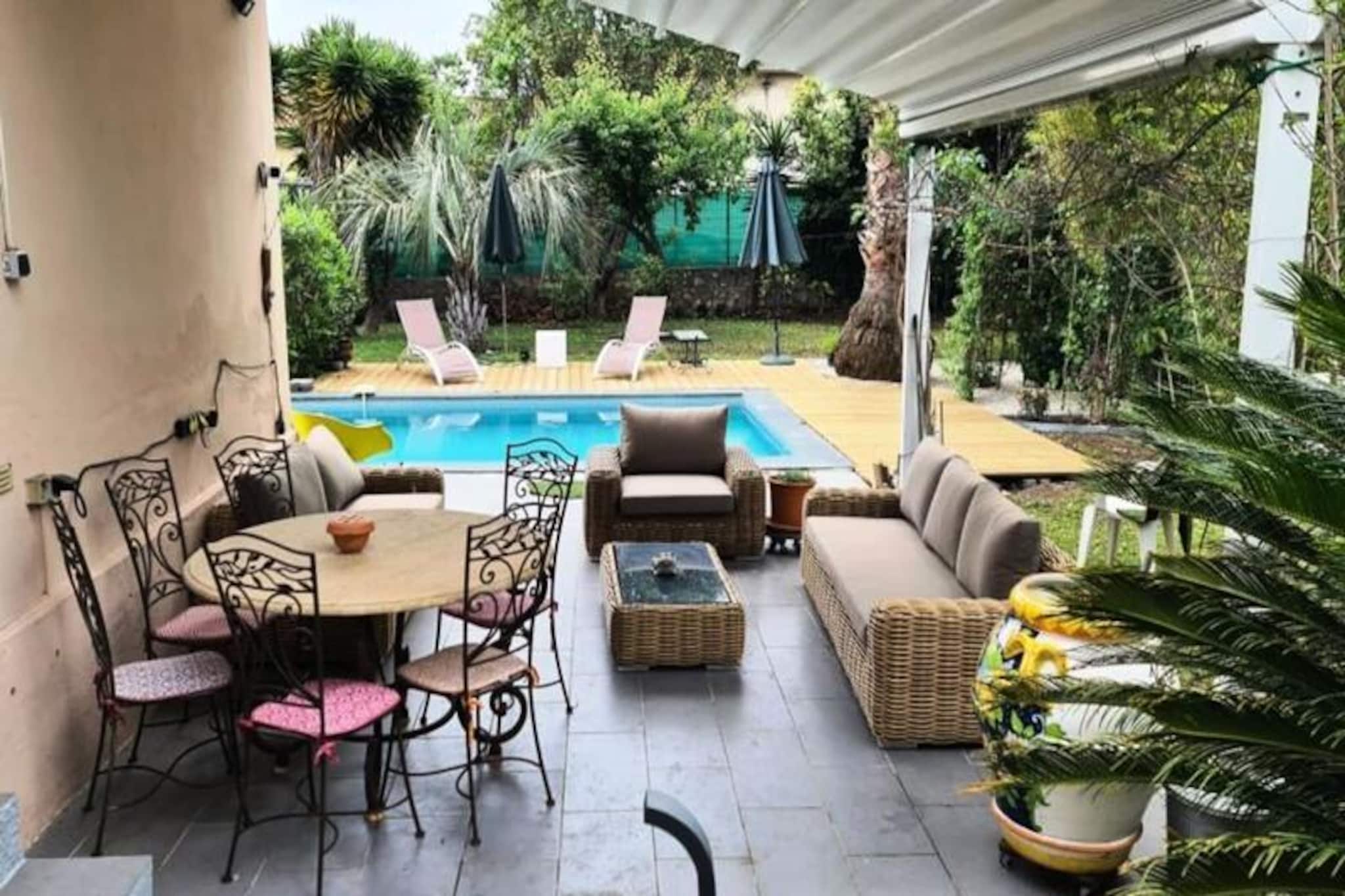 In the heart of the charming coastal town of Antibes, this delightful family home offers a perfect blend of comfort and convenience. Surrounded by the vibrant energy of the French Riviera, the property is just a short stroll from sandy beaches, local markets, and the historic old town. Whether you’re seeking a relaxing retreat or an adventure-filled getaway, this home provides an ideal base for exploring the beauty of the Côte d'Azur. 

Step inside this single-story home and discover a thoughtfully designed space of 120 m², complete with modern amenities to ensure a comfortable stay. The open-plan living area features a cozy lounge with air conditioning and Wi-Fi, seamlessly connected to a fully equipped kitchen with everything you need to prepare delicious meals. The home boasts three spacious bedrooms, two of which offer serene views of the private pool and garden. With two bathrooms, including one with a bathtub, the property is well-suited for families or groups of up to seven guests. 

Outside, the 720 m² garden is a true oasis. Relax on the outdoor furniture, take a refreshing dip in the private pool, or enjoy a leisurely meal al fresco. The pool is yours to use at any time, providing a tranquil escape from the bustling town. A private parking space is also available, though it is best suited for small cars due to the narrow alley access. 

Located on a quiet residential street, the home is just minutes from Antibes’ top attractions. Wander to the Provençal Market or Place Nationale to soak in the local culture, or head to La Gravette Beach for a day by the sea. With the train station only a 7-minute walk away, you’ll also have easy access to explore nearby gems like Cannes and Nice. This property promises a memorable stay in one of the most picturesque corners of France.