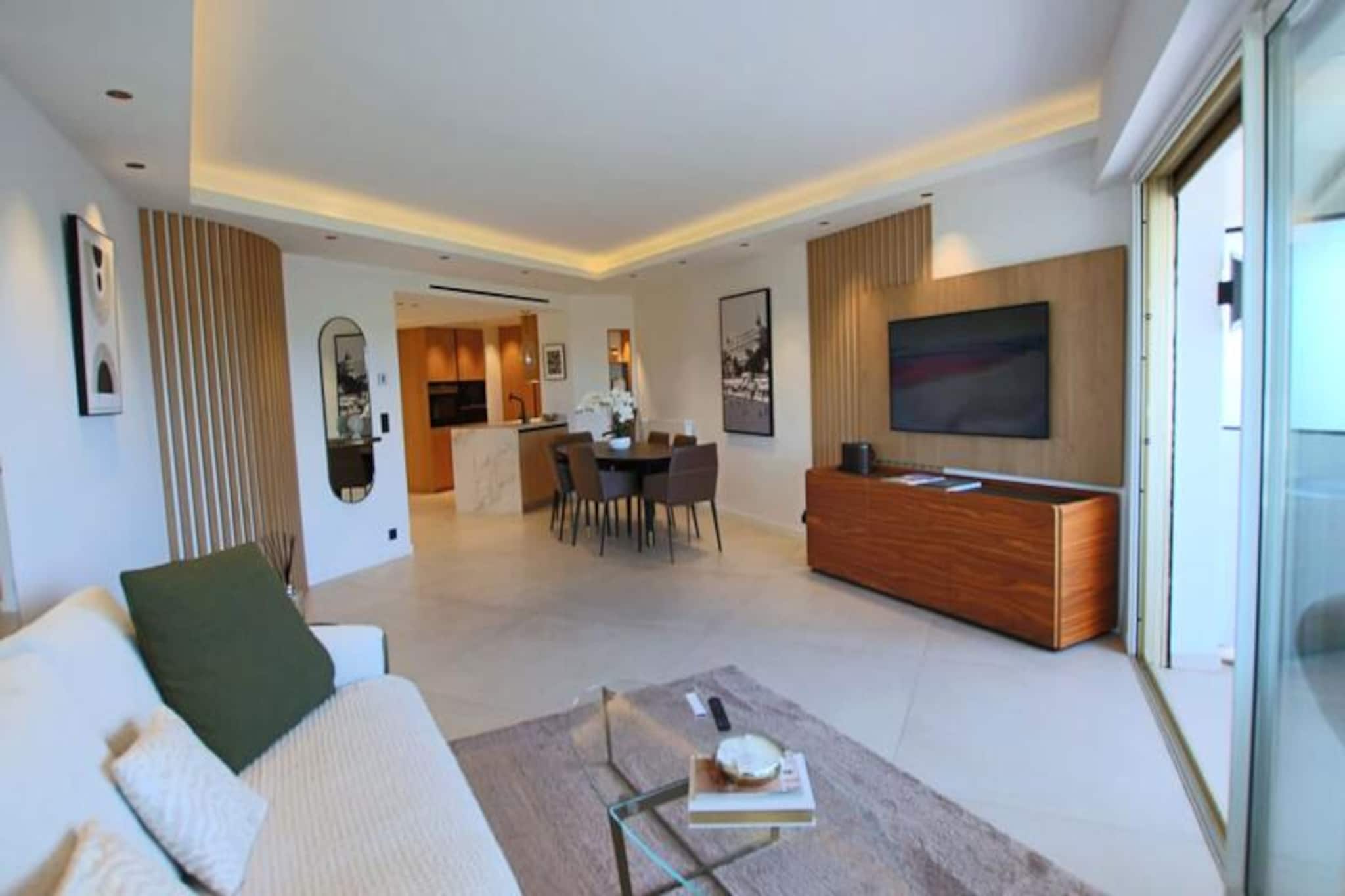 Awaken to the gentle Mediterranean breeze in this elegantly renovated apartment, perfectly situated in the prestigious Palm Beach neighborhood of Cannes. Just steps from the iconic Croisette and Square Verdun, this serene retreat offers a harmonious blend of luxury and tranquility, with lush greenery and a glimpse of the sparkling sea as your backdrop. Whether you're here for the beaches, the glamour of Cannes, or a peaceful escape, this property promises an unforgettable stay. 
 
 Inside, the apartment boasts three en-suite bedrooms, each thoughtfully designed for comfort and privacy. The bright double living room opens onto a south-facing terrace, where you can unwind with unobstructed views of verdant landscapes and the distant sea. A fully equipped open-plan kitchen invites you to prepare meals with ease, while modern amenities such as air conditioning, Wi-Fi, and a laundry room ensure every convenience is at your fingertips. The refined decor and attention to detail create a space that feels both luxurious and welcoming. 
 
 Step outside and find yourself just 100 meters from the sandy beaches of Square Verdun and a short stroll to Port Canto and Place de l'Étang. The vibrant Palm Beach area offers a variety of dining options, boutique shops, and cultural experiences, all within walking distance. For those seeking the glamour of Cannes, Rue d’Antibes and the Palais des Festivals are just a 15-20 minute walk away. 
 
 Whether you're savoring a sunset at Harry's Bar, exploring the luxurious boutiques along the Croisette, or simply relaxing on your private terrace, this apartment is the perfect base for experiencing the best of Cannes. Let the charm of the French Riviera captivate you in this exceptional home away from home.