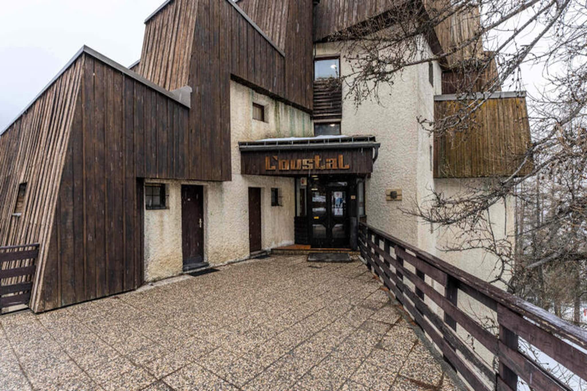 Surrounded by the serene beauty of larch trees, this charming apartment in the L’Oustal residence invites you to experience the magic of the French Alps. Whether you’re seeking thrilling adventures or peaceful moments, this mountain retreat offers the perfect blend of comfort and convenience. Imagine waking up to the crisp alpine air, stepping onto your private balcony, and gazing at the tranquil forest views before embarking on a day filled with excitement. Located just steps from the slopes, it’s a haven for ski enthusiasts and nature lovers alike. \n\nInside, the apartment boasts a cozy yet functional layout, accommodating up to six guests across its 28 m² of living space. The fully equipped kitchen, complete with a Senseo coffee machine, raclette grill, and toaster, opens onto the living room, creating a warm and inviting space for shared meals and laughter. Sleeping arrangements include bunk beds in the bedroom, a pull-out sofa bed in the mountain alcove, and another sofa bed in the living room, ensuring restful nights for everyone. After a day of adventure, unwind in the renovated bathroom featuring a soothing bathtub, or take advantage of the washing machine and hairdryer for added convenience. \n\nSituated in the heart of the 1650 resort, you’ll find everything you need within a hundred meters—mini-market, bakery, souvenir shops, and restaurants. The resort’s activities, from mountain biking and snow sports to zip-lining and treetop adventure courses, promise unforgettable memories for all ages. With direct access to the slopes and a private ski locker, this residence is a gateway to endless alpine adventures. \n\nWhether you’re here to ski, hike, or simply relax, this apartment offers a peaceful yet vibrant escape in the heart of the mountains. Create lasting memories with family or friends in this idyllic setting where nature and comfort come together seamlessly.