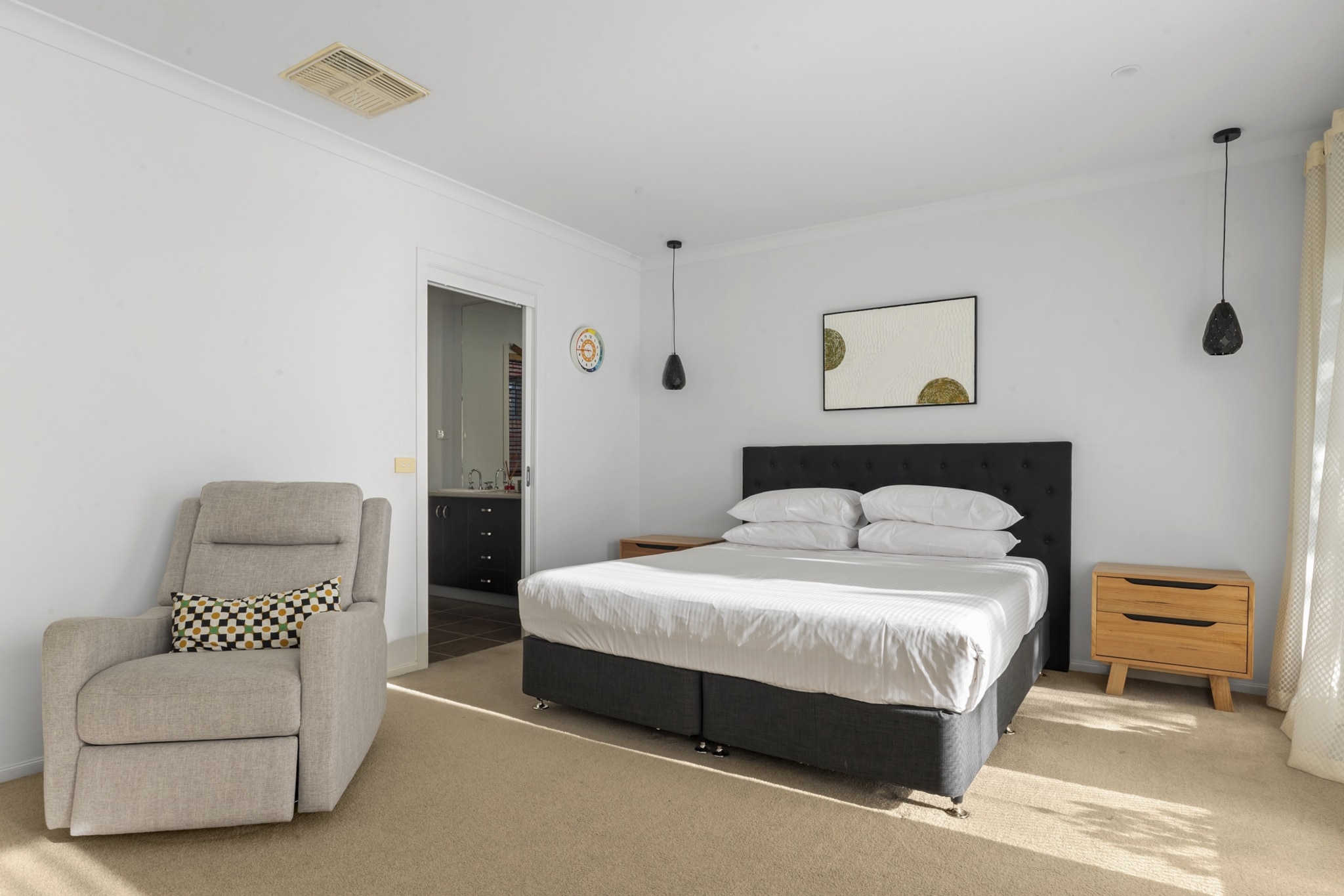 Property description
Located in Point Cook, this modern 4-bedroom home offers generous living spaces, keyless self-check-in and a private patio ideal for relaxing evenings. With central heating and cooling, two bathrooms, and convenient driveway parking, it’s a perfect retreat for families and business guests seeking comfort and space close to Melbourne’s western attractions.
The space
Step inside this light-filled, single-level home where comfort meets functionality. The open-plan living area features a six-seater dining table, wooden floors, a four-seater and two-seater sofa, and a Smart TV with streaming and free-to-air channels. The sleek kitchen is fully equipped with a cooktop, oven, dishwasher, microwave, and coffee machine.
Four spacious bedrooms offer restful nights with blackout blinds and a king room with ensuite, two queen rooms, and a single room. Bathrooms are clean and functional, with modern fittings, a hairdryer, and essentials provided. The private laundry includes a washer, dryer, iron, and board for added convenience.
Step through the living room doors to a private patio — a quiet spot to unwind. Central heating and cooling ensure year-round comfort, while natural touches like indoor plants add a welcoming feel throughout.