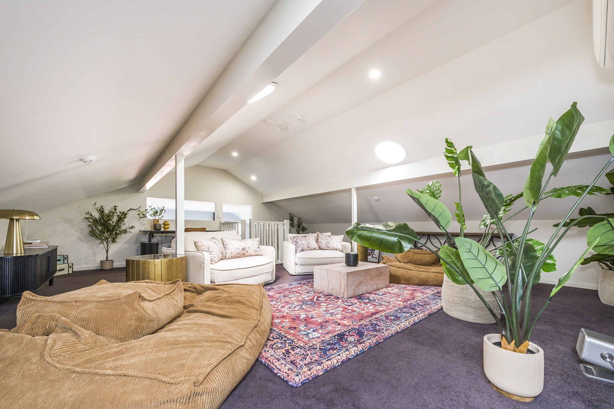 Property description
Light-filled penthouse with huge windows, soaring ceilings, a cinema, and games loft. This urban â€œgreen houseâ€ is a multi-level oasis, ideal for groups. Enjoy a private theatre, games loft, or explore the vibrant precinct nearby. Perfect for bridal parties, family visits, or friendsâ€™ get-togethers. Great for grown-up kids who love entertainment, while adults relax downstairs. Also suited for corporate stays, with open-plan office and sit-stand desk.
The space
Step into a welcoming, light-filled living area that seamlessly blends style with comfort. The space features wooden-look vinyl flooring and a large rug, enhancing the modern aesthetic. Relax on the comfy couches while enjoying the smart TV, complete with Netflix subscription and streaming access. For family fun, the home also includes a PlayStation, a growing collection of books and board games, plus a chess set for game nights.
 
The dining area is ideal for shared meals, while the fully equipped kitchen provides everything you need to cook at homeâ€”including an air fryer, microwave, oven, coffee machine, kettle, and even a popcorn maker for that extra touch of indulgence.
 
The three bedrooms offer cosy, restful spaces with blackout blinds, firm mattresses, and generous storage. The master bedroom includes an en-suite bathroom, while the second bathroom features modern fittings and convenient amenities.
 
One of the standout features of the property is the private theatre room with a large projector screen, perfect for movie marathons or family cinema nights. To make it extra enjoyable, guests can whip up fresh popcorn and settle in for a true home-theatre experience.
 
For younger guests (or those young at heart), the home includes colouring pens, pencils, textas, and colouring books, ensuring entertainment options for every age.