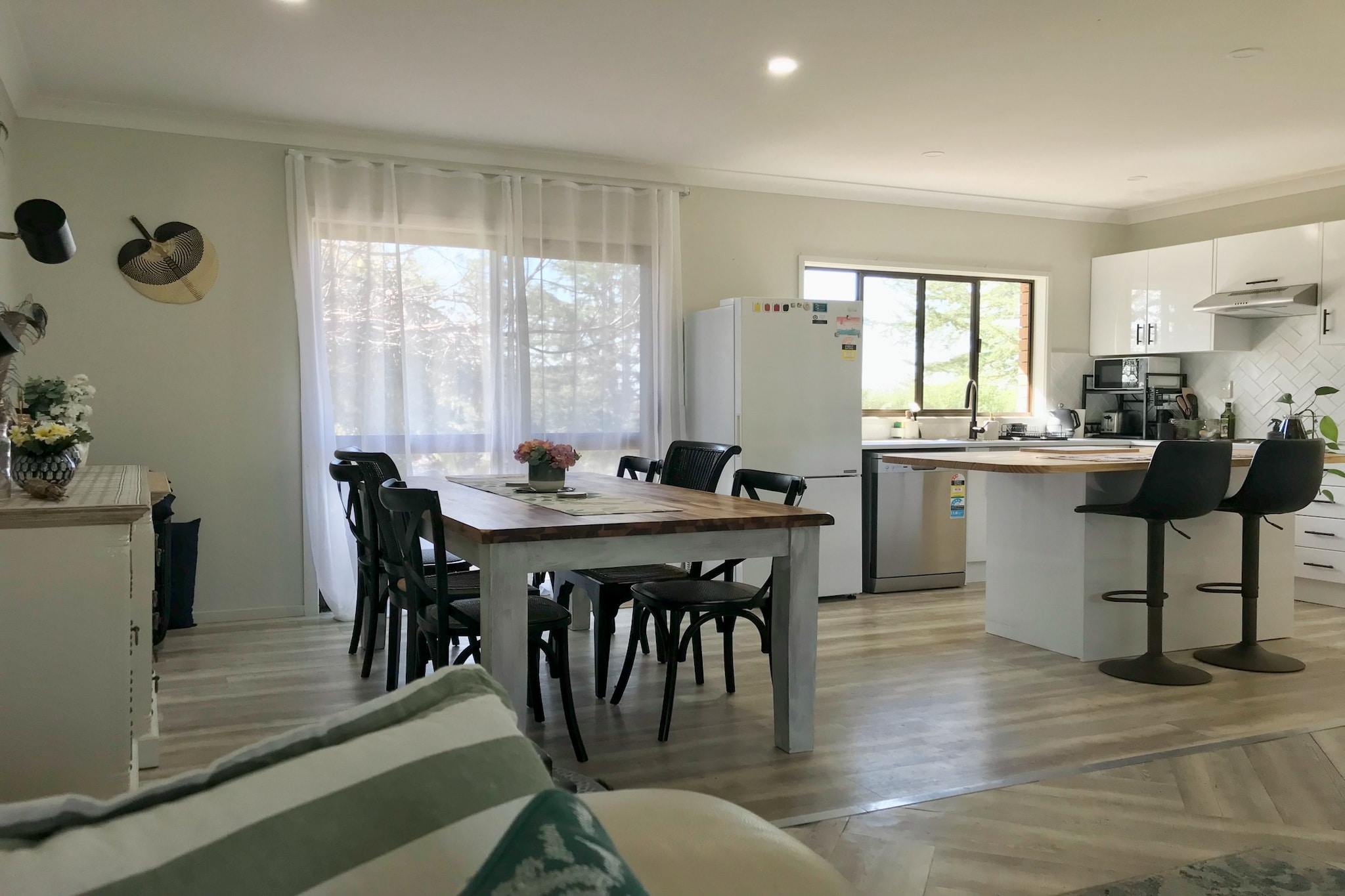 Property description
Discover this stylish 3-bedroom home in the heart of Tenterfield, perfect for families or groups seeking comfort and convenience. Enjoy a spacious interior, with two living areas, private outdoor patio, and seamless self-check-in. Located near local cafÃ©s, shops, and parks, this inviting stay offers a relaxed retreat in a charming country town.

The space
Step into a beautifully presented Tenterfield home that blends charm with functionality. The living area invites you in with its plush three-seater sofa and natural light, creating a warm space to unwind. The dining area connects seamlessly with the fully equipped kitchen, perfect for shared meals and conversations. Each of the three bedrooms offers a tranquil escapeâ€”two with comfortable queen beds and one with a single bedâ€”complemented by generous storage. The bathroom features a separate shower and bath, while the dedicated laundry includes a washer for your convenience.
 
Outside, a paved courtyard and patio garden provide a peaceful setting to enjoy a morning coffee or evening drink. With thoughtful furnishings, elegant finishes, and ambient lighting, this home offers a cosy yet spacious atmosphere ideal for families, professionals, or groups. Relax, recharge, and explore the beauty of Tenterfield from this perfectly located retreat.