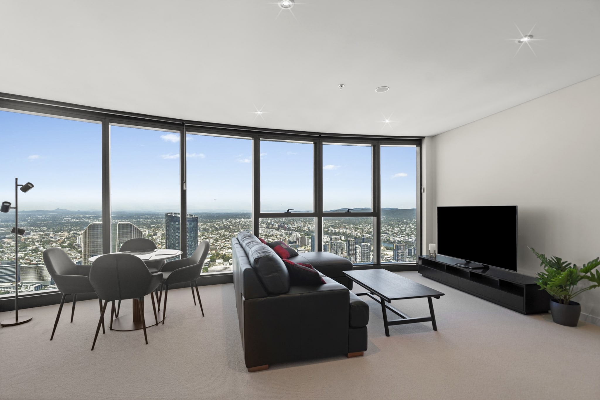 Property description
Soaring above Brisbane’s CBD, this sleek one-bedroom apartment offers stunning views and luxurious amenities. Enjoy expanding views from the communal pool, gym, steam room, and BBQ lounge on level 66. With central A/C, stylish interiors, and seamless key collection nearby, this high-rise haven is ideal for business trips or weekend escapes.
The space
Perched on the 81st floor, this modern apartment offers a tranquil escape with sweeping city views. The light-filled living area features a 3-seater couch, a smart TV, and a soft rug atop plush carpet flooring. A dedicated dining space seats four comfortably, and a study nook just off the entrance provides the perfect place for remote work or reading.
The fully equipped kitchen boasts a gas stove, electric oven, capsule-compatible coffee machine, and quality appliances for effortless home cooking. Retreat to the serene bedroom, complete with a king bed, blackout blinds, bedside tables, and soft lighting for restful evenings.
The sleek bathroom includes a modern vanity and shower, with a washer and dryer discreetly tucked away in the private laundry.
Guests can access a premium experience including a gym, pool, steam room, BBQ, and outdoor lounge on level 66. Whether you're here for work or leisure, this property combines comfort, convenience, and luxury in the heart of Brisbane.