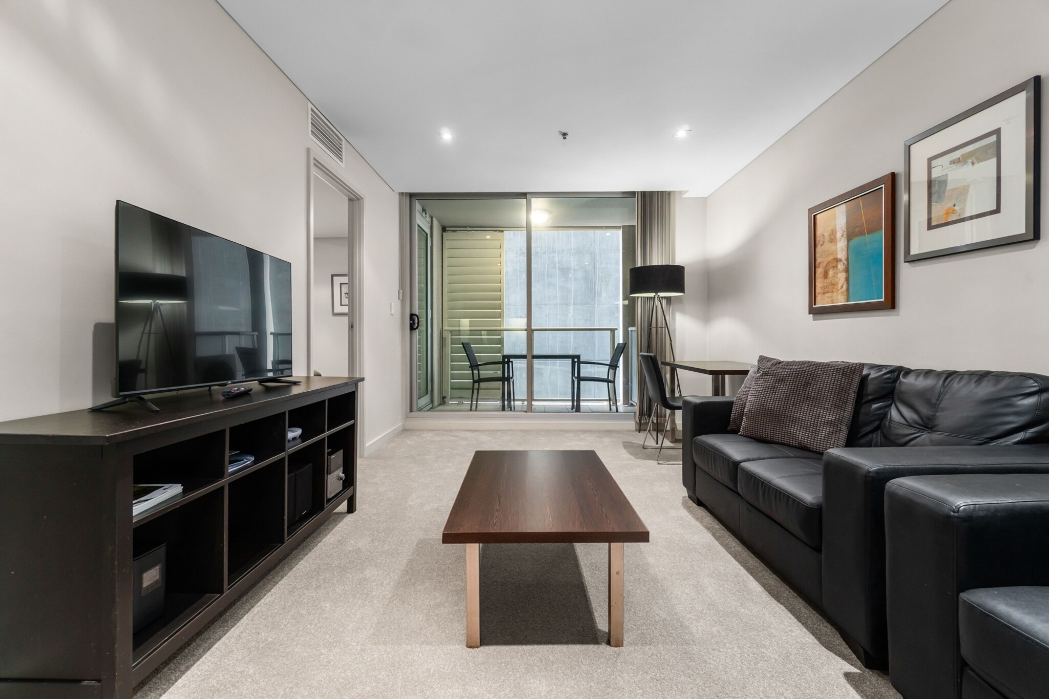 Property description
Located in the heart of Adelaide, this modern 2-bedroom apartment offers a bright living space and sleek kitchen, perfect for city travellers. Enjoy self-check-in, plus access to the on-site gym and pool. With cafés, shops, and attractions just steps away—and Adelaide Oval only a 5-minute walk via the bridge—it’s ideal for both business and leisure stays.
The space
Step inside this elegant city apartment and enjoy a welcoming blend of comfort and functionality. The open-plan living area features two spacious sofas, a coffee table, and artwork that brings personality to the space. A dining table with seating for four flows into the stylish kitchen, equipped with essential cookware and appliances for your stay.
Both bedrooms offer queen beds with bedside tables, blackout blinds and built-in storage, ensuring a peaceful night’s rest. The single bathroom is neatly presented with a walk-in shower and all the essentials. Natural and artificial plants add a touch of greenery, while the soft lighting enhances the apartment’s cosy ambiance.
The private balcony, accessed via sliding doors, offers a lovely outdoor seating area with two chairs and a table — ideal for enjoying your morning coffee or evening glass of wine. With air conditioning, laundry facilities, and access to a gym and pool, this apartment provides everything needed for a comfortable stay in Adelaide’s lively CBD.