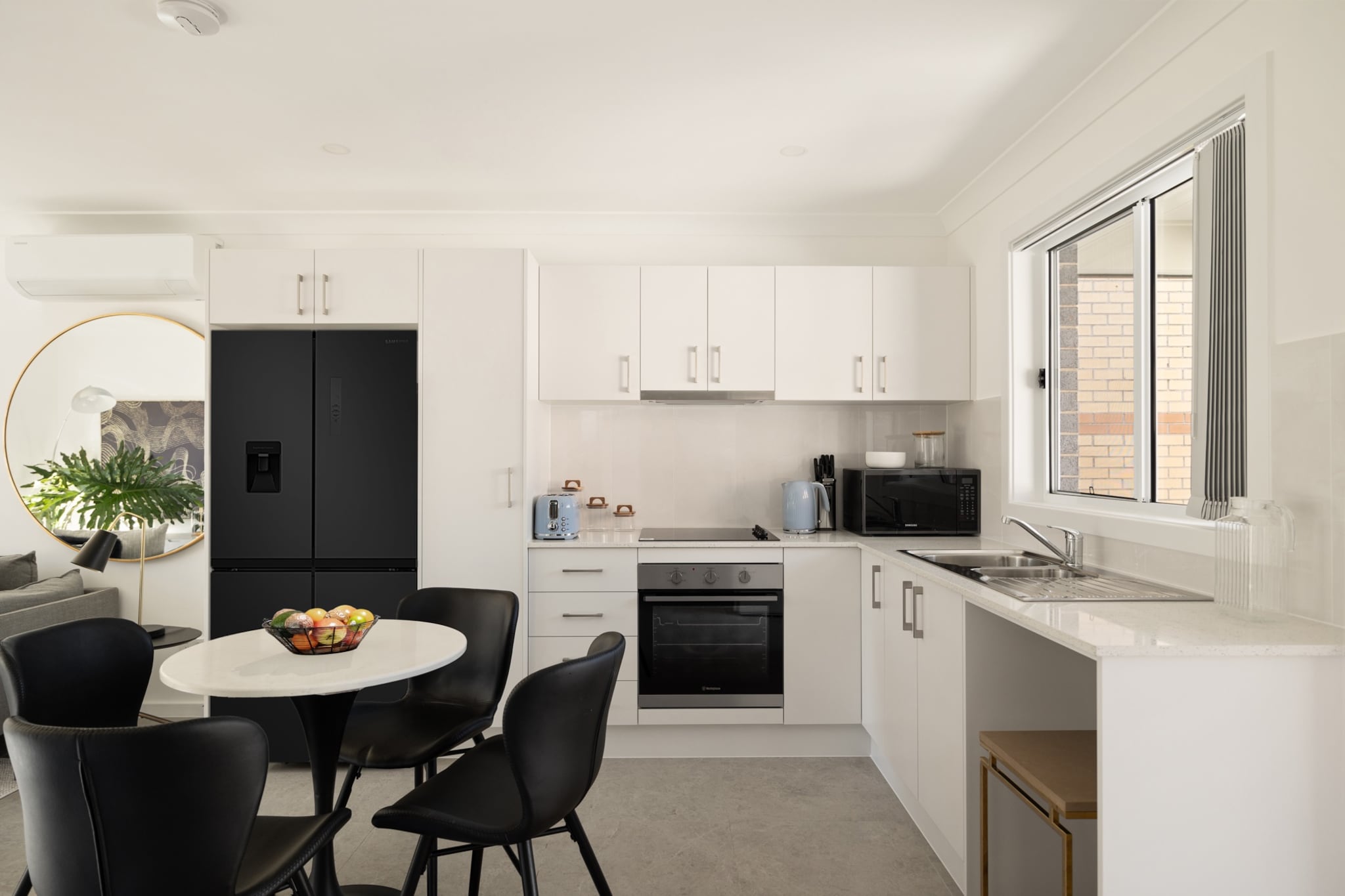 Property description
Moments from Brighton-Le-Sands Beach, this two-bed flat blends comfort and convenience. Enjoy a bright living area with split-system A/C, a fully equipped kitchen and seamless self-check-in via onsite lockbox. With on-site parking and a shared outdoor space, itâ€™s a relaxed base for bayside strolls and local dining.
The space
Step in from McCoy Lane through a private entrance and find a light-filled living area dressed with soft textures, a three-seat sofa and a smart TV for cosy evenings in. The dining space seats four, flowing to a well-appointed kitchen with induction cooktop, oven, microwave, kettle and toasterâ€”ready for easy breakfasts or unhurried dinners. Cool air drifts from the split-system A/C in the lounge, while tiled floors keep things fresh underfoot.
 
Two restful bedrooms each feature double beds with blackout blinds for an unrushed sleep. The bathroom is thoughtfully arranged, offering a refreshing shower, hotel-style essentials and a hairdryer. In-home laundry facilities, neatly placed within the bathroom, include a washing machine, iron and drying rackâ€”ideal for longer stays.
 
Slide open to the shared outdoor area from the living room and claim a spot on the outdoor furniture with a morning coffee before wandering to the waterfront. A beautiful home, which is a breezy base for beach days and bayside dining.