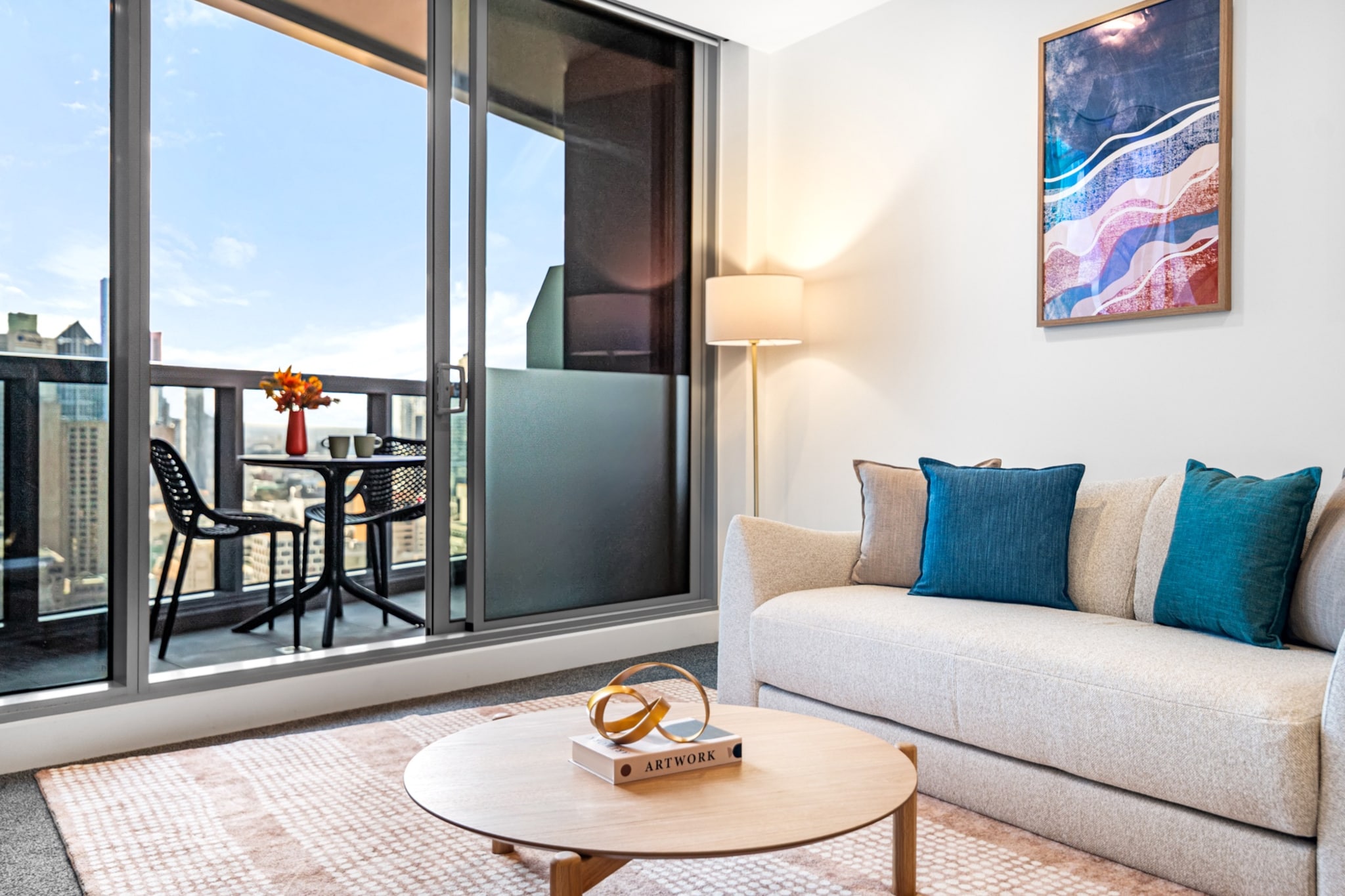 Property description
Perfectly located in Southbank, this inviting apartment features an open-plan layout, a stylish living area with a sofa bed, and a peaceful queen bedroom. Enjoy a private balcony, modern kitchen, pool and sauna and dedicated study nook. With self-check-in and easy access to city attractions, it’s ideal for both business and leisure stays.
The space
Step into a contemporary city escape high above Southbank’s bustling streets. The spacious living area offers plush seating and tasteful styling, complete with a coffee table, rug, and smart TV for winding down after a day exploring Melbourne. Floor-to-ceiling windows flood the space with natural light and open out to a private balcony – perfect for morning coffee or an evening drink.
The sleek kitchen is equipped with modern appliances including a gas stovetop, oven, dishwasher, and coffee machine, making it easy to prepare meals. Dine at the table with seating for four or opt for a relaxed meal on the balcony.
The queen bedroom includes blackout blinds, a wardrobe, and soft bedding for a restful night’s sleep. A sofa bed in the living room offers extra flexibility for guests. Nearby, a dedicated study nook provides a quiet space for remote work or reading.
The bathroom is clean and well-maintained, and the private laundry includes both washer and dryer for convenience. With stylish touches throughout and access to shared building facilities like a gym and garden cinema, this apartment combines comfort and practicality in an unbeatable location.