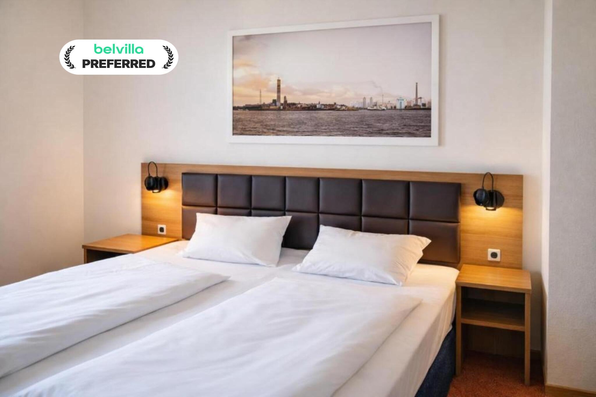 In the center of Aalborg, Hotel Jomfru offers a comfortable and welcoming stay on the well-known Jomfru Ane Gade pedestrian street. The hotel has bright interiors, friendly service, and free Wi-Fi. Guests can enjoy breakfast in the dining area, and weekend snacks for purchase. Discount vouchers for nearby restaurants and cafés make your stay even more convenient and affordable.

Room Features – Premium Double Room
1. Comfortable double bed
2. Private bathroom with shower, hairdryer, toiletries
3. Flat-screen TV with cable channels
4. Tea and coffee-making facilities
5. Work desk for planning or working
6. Heating, fan, and single-room AC
7. Non-smoking room with simple, cozy décor

Hotel Amenities & Guest Perks:
1. Free high-speed Wi-Fi throughout the hotel
2. Daily breakfast 
3. Weekend snacks and drinks available
4. Restaurant and café discount vouchers
5. Occasional promotions like late check-out weekends and long-stay offers
6. Non-smoking hotel with family rooms available
7. Express check-in and check-out
8. CCTV, smoke detectors, and fire safety systems
9. Paid parking for DKK 130/night

Nearby Attractions:
1. Aalborghus Castle – approx. 250 m
2. Aalborg Train Station – approx. 13 minutes walk
3. Aalborg Historical Museum – approx. 600 m
4. Limfjord waterfront nearby
5. Shops, cafés, nightlife, and old town streets around the hotel

How to Reach Hotel Jomfru:
1. Short walk from Aalborg Train Station
2. Easy access by local buses
3. Aalborg Airport – approx. 15 minutes by car

Book your stay today and enjoy a simple, comfortable, and well-located hotel in the heart of Aalborg.