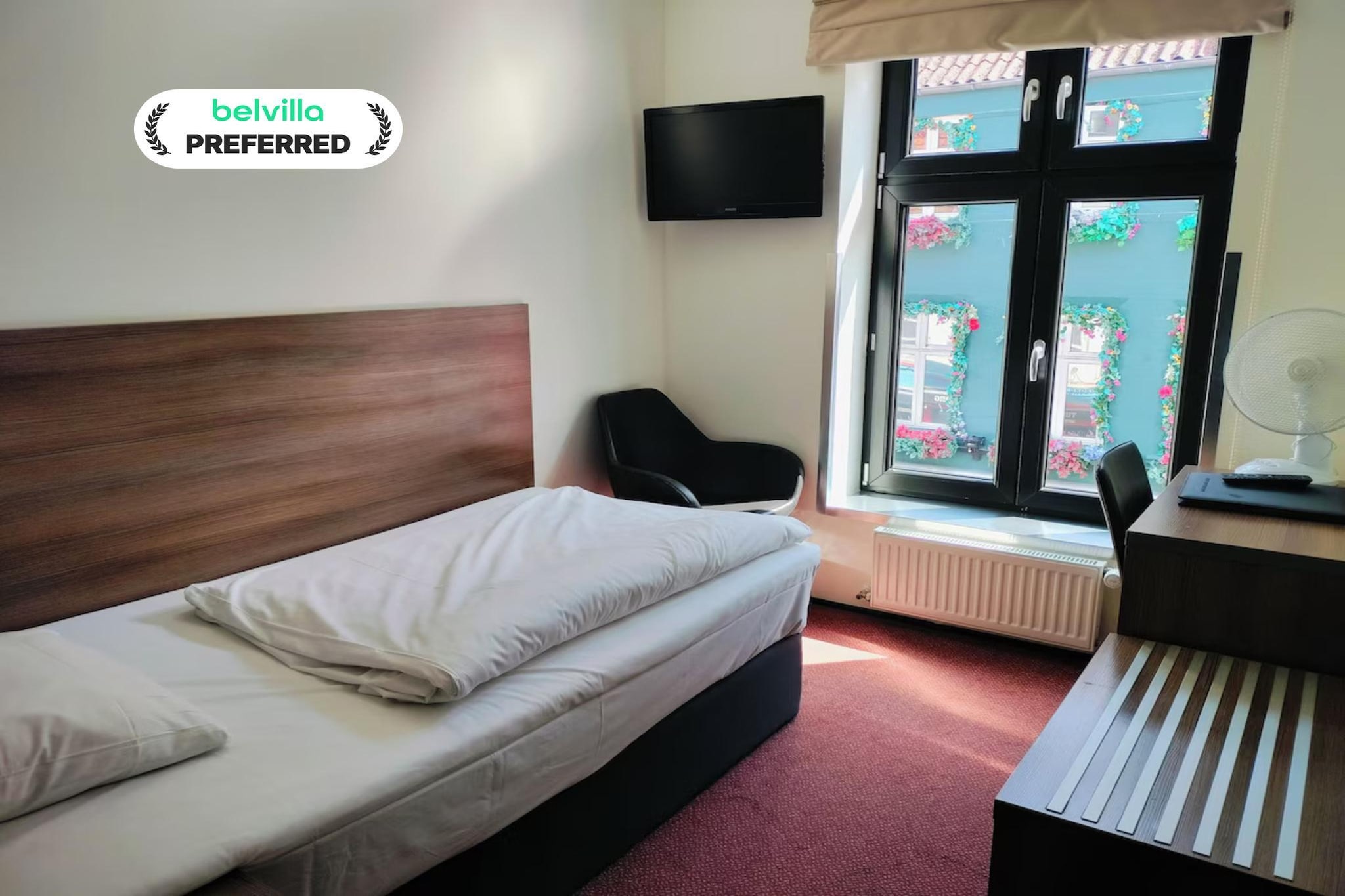 Located on the bustling Jomfru Ane Gade pedestrian street in central Aalborg, this welcoming hotel offers modern comfort in one of the best city-center locations. Bright, tastefully decorated interiors create a warm atmosphere, and free Wi-Fi keeps guests connected throughout the property. Each morning begins with a fresh breakfast service available in a light-filled dining room, while weekend snacks and beverages can be purchased at reception.

Premium Single Room Features -
1. Comfortable single/twin bed ideal for solo travellers
2. Private bathroom with shower, towels, and complimentary toiletries
3. Flat-screen TV for entertainment
4. Heating and air conditioning for year-round comfort
5. Desk, iron, hairdryer, and fan included
6. Warm décor and a quiet, well-kept environment
7. Non-smoking room with simple, modern design

Hotel Amenities -
1. Free high-speed Wi-Fi throughout the hotel
2. Breakfast buffet service available in a bright dining area
3. Weekend snacks and drinks available at reception
4. Cozy common areas for relaxing
5. Smoke detectors, fire safety system, and CCTV
6. Express check-in/check-out services
7. Friendly multilingual staff
8. Paid parking for 130DKK/night

Nearby Attractions -
1. Aalborghus Castle – approx. 250 m
2. Aalborg Train Station – approx. 13 minutes on foot
3. Aalborg Historical Museum – short walk
4. Limfjord waterfront for scenic strolls
5. Restaurants, cafés, and shops right outside the hotel

How to Reach -
1. Easy walk from Aalborg Train Station
2. Well-served by local bus connections
3. Aalborg Airport – approx. 15 minutes by car

A comfortable, convenient, and centrally located stay—perfect for solo travellers exploring Aalborg.