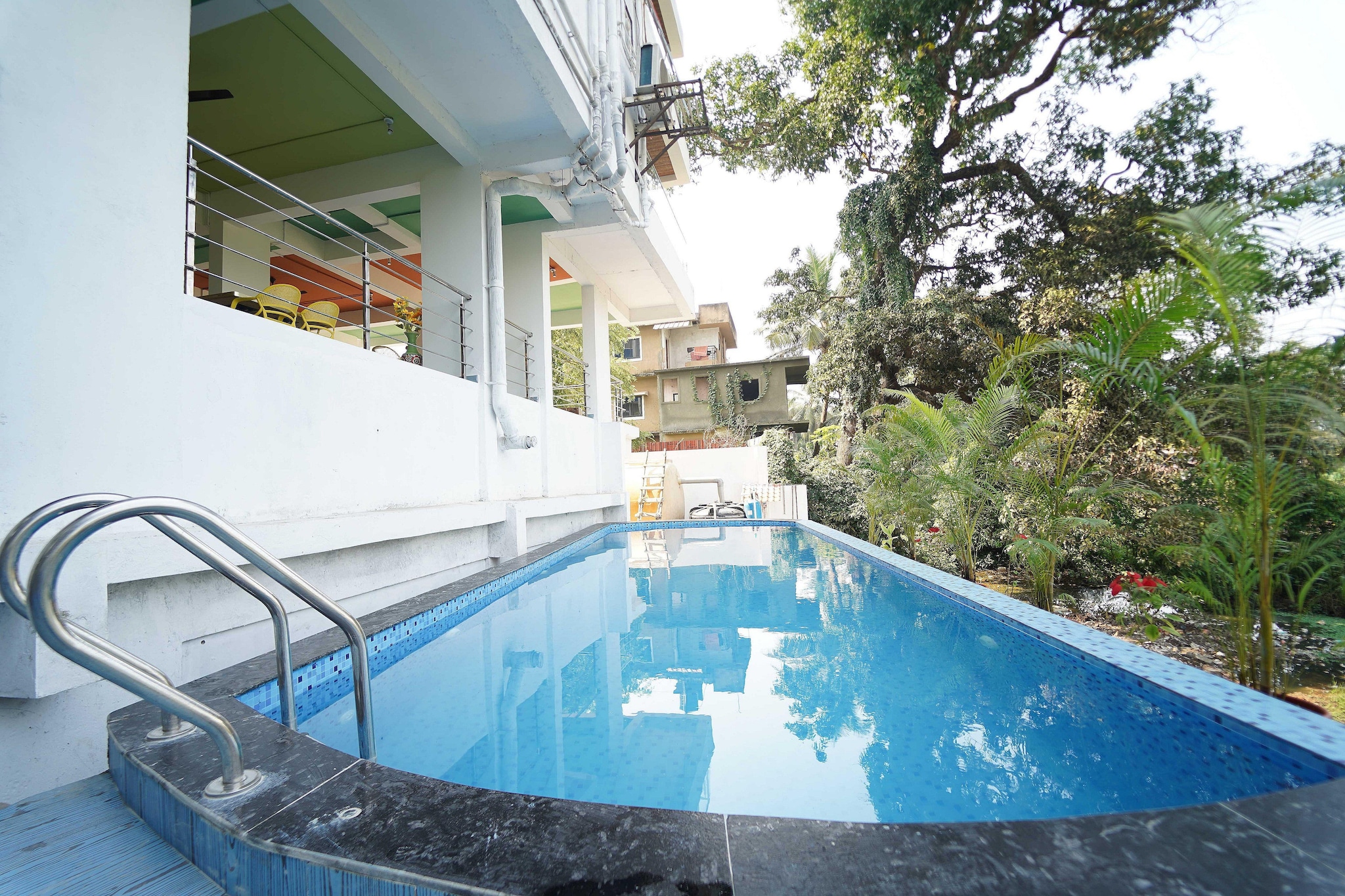 Ground floor: (Living room(single sofa bed, TV, dining table), Kitchen(electric kettle, coffee machine, microwave, fridge), bedroom(double bed, TV(flatscreen)), bedroom(double bed, TV(flatscreen)), bedroom(double bed, TV(flatscreen)), bedroom(double bed, TV(flatscreen)), bedroom(double bed, TV(flatscreen)), bathroom(shower, washbasin, toilet, shampoo, body soap), bathroom(shower, washbasin, toilet, shampoo, body soap), bathroom(shower, washbasin, toilet), bathroom(shower, washbasin, toilet), bathroom(shower, washbasin, toilet), balcony, swimming pool(private), iron)