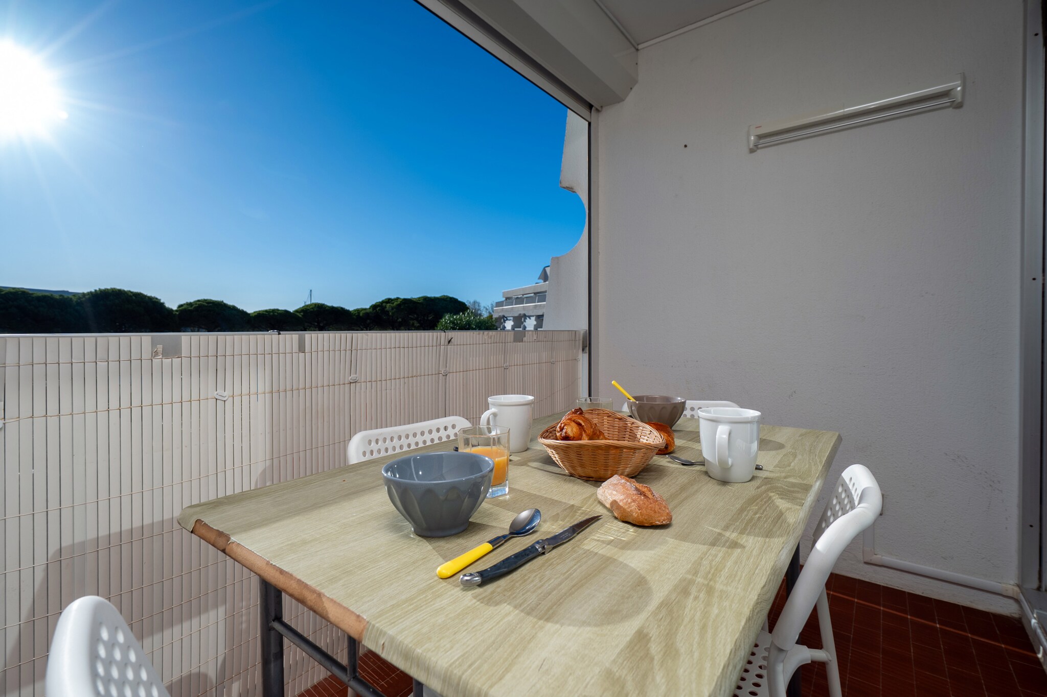 open kitchen(electric kettle, toaster, coffee machine, microwave, fridge, dishes and cutlery), Living/bed room(double sofa bed, bunk bed, dining table), bathroom(bath tub, washbasin, toilet), balcony