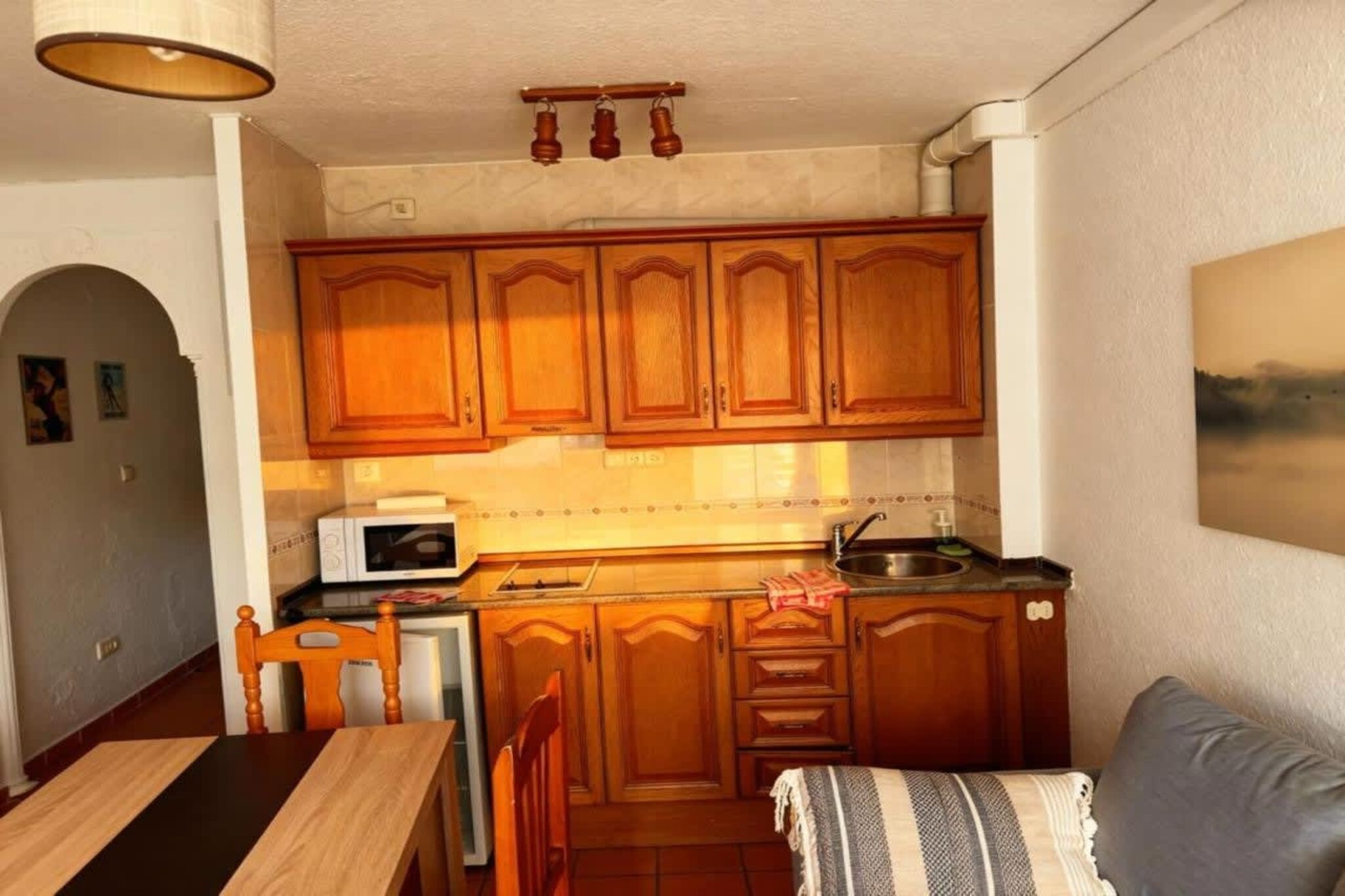 Located in the Mont Blanc Building, in the heart of Sierra Nevada, this spacious apartment with garage combines comfort, functionality, and stunning mountain views, offering the perfect space to enjoy an unforgettable getaway in the snow.

With a surface area of 65 m², the accommodation has two cozy bedrooms, a bright living room with a sofa and dining area overlooking the natural surroundings, and a fully equipped private bathroom with a shower. The practical and modern kitchen has a refrigerator, microwave, coffee maker, and basic kitchen utensils, ideal for preparing homemade meals during your stay.

With capacity for up to 6 people, the apartment offers three comfortable beds to ensure a good night's sleep for all guests.
Additional amenities include a TV, heating, a wardrobe, towels, bedding, and cleaning products. Smoking is also permitted inside the accommodation for added flexibility and convenience. The apartment includes free parking, a highly valued advantage for those travelling by car, and free Wi-Fi throughout the premises.

Extra benefits for guests include - discounted ski passes to avoid lines before your arrival, discounted ski equipment, discounted ski lessons with certified multilingual instructors, and free lockers with boot drying to keep your equipment in perfect condition.