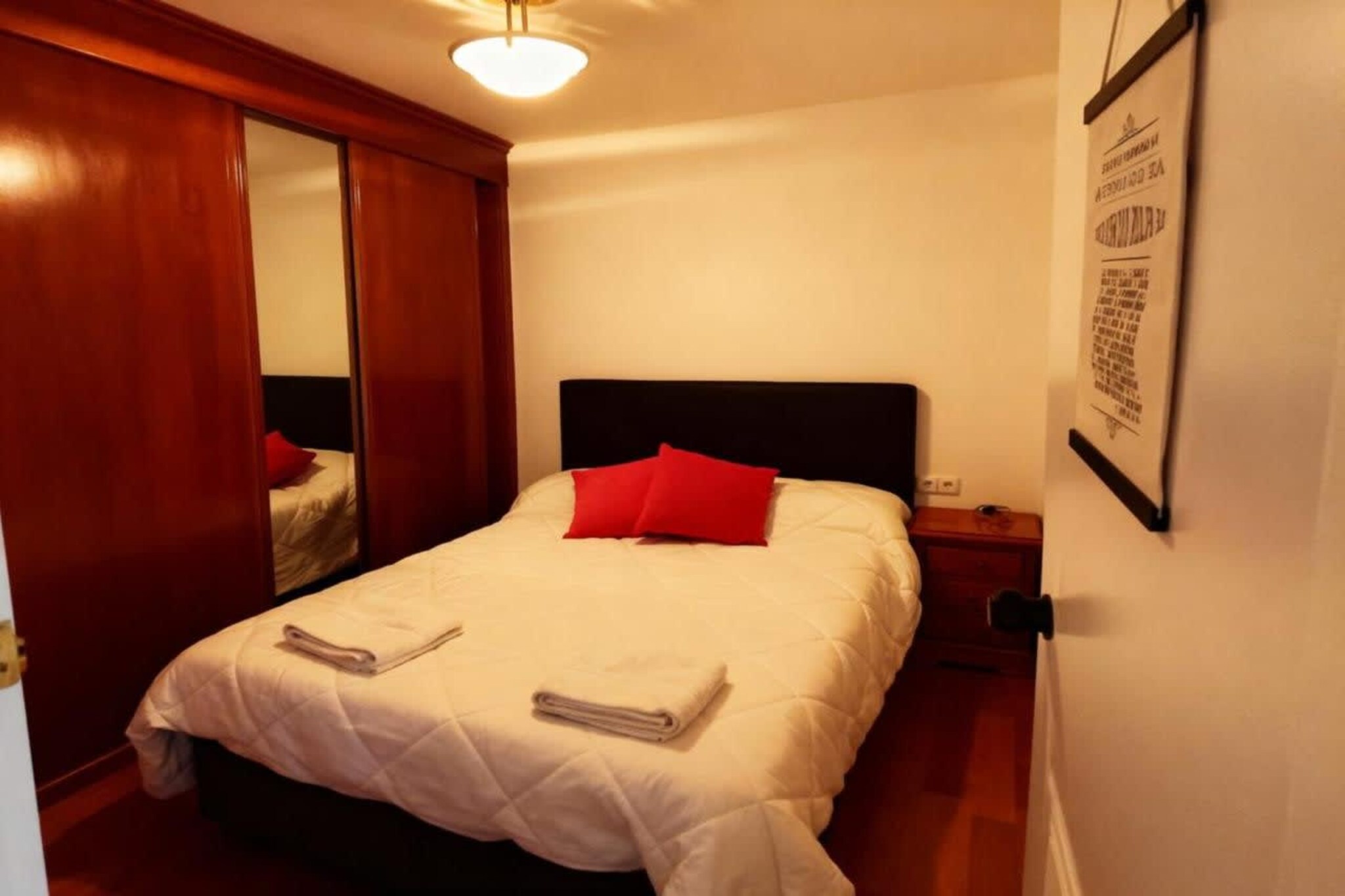 Kitchen(stove, toaster, coffee machine, microwave, dishwasher, fridge-freezer, dishes and cutlery, Cooking basics), Living/diningroom(TV, dining table, seating area), bedroom(bunk bed, bunk bed), bedroom(double bed), bathroom(shower, washbasin, toilet), Internet access, heating, parking, hot water