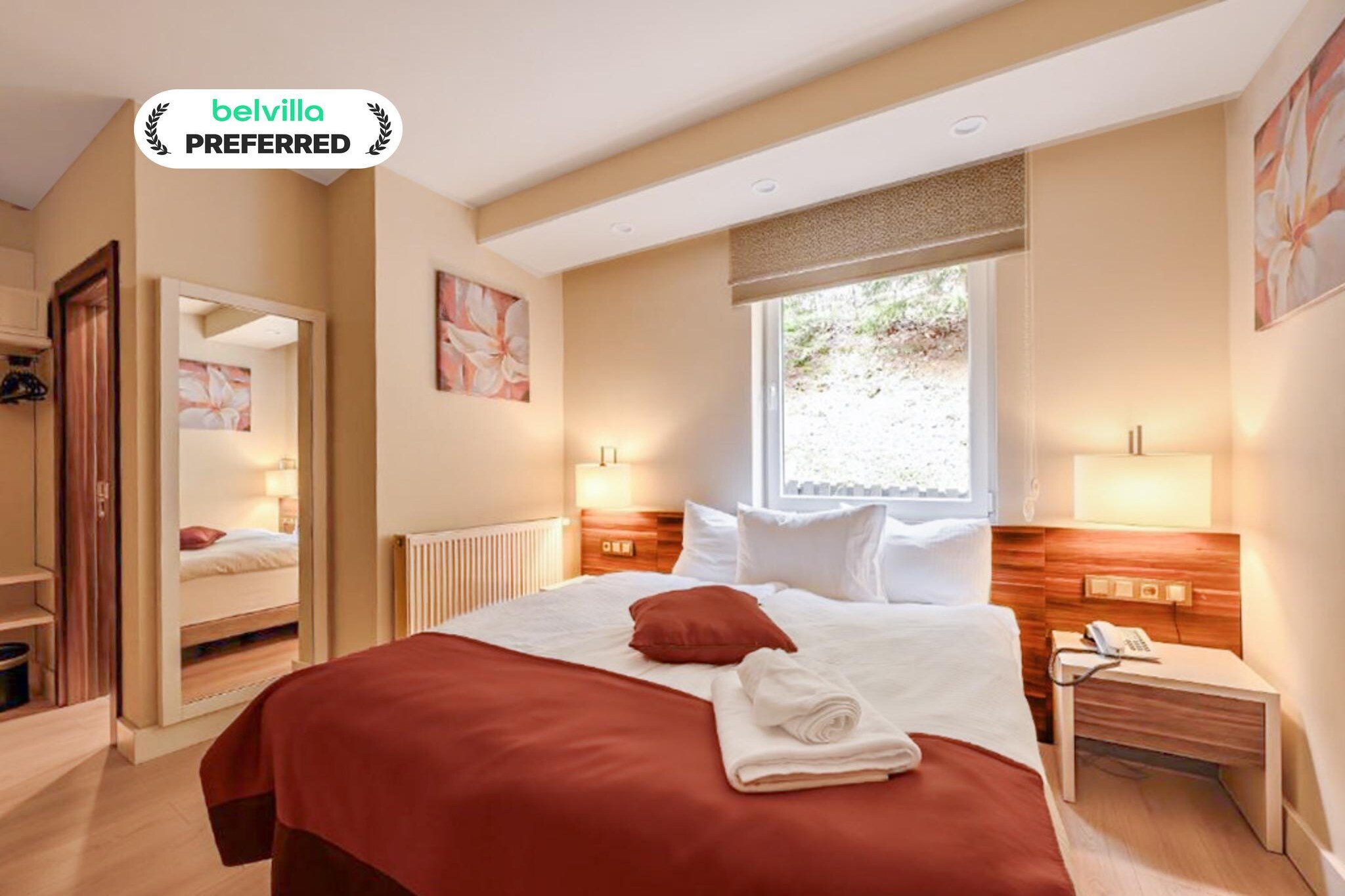 Imagine waking up to pine-scented air, soft forest light, and distant hills greeting you at sunrise. This balcony room at Hotel Schwarzbachtal Hideaway offers exactly that - a calm, cozy retreat surrounded by woodlands and rolling mountain slopes. It’s ideal for couples or solo travellers who want nature, fresh air, and simplicity without giving up comfort.
Room Features – Double Room with Mountain and Lake View
1. Private balcony overlooking the lake and the mountains
2. Comfortable double bed for peaceful rest
3. Large windows fill the room with natural light
4. Private bathroom with shower and fresh towels
5. Seating area perfect for reading or quiet moments
6. Heating and air conditioning for all seasons
7. TV, free high-speed Wi-Fi, and a small minibar
8. Warm and simple décor enhancing the natural setting
9. Pet-friendly on request (Euro 18 per pet per night)
Hotel Amenities -
1. On-site restaurant serving regional dishes
2. Sauna and spa area for relaxing after hikes or ski days
3. Secure paid parking (Euro 5 per vehicle per day) and luggage storage
4. Ski equipment storage for winter guests
5. Non-smoking environment for peaceful stays
6. Friendly staff offering local tips
Nature & Nearby Activities -
1. Direct access to trails in Vogtland Nature Park
2. Hiking paths, cycling routes, and quiet forest corners
3. Nearby Erlbach Kegelberg Ski Area for winter sports
4. Scenic spots perfect for nature walks and photography
How to Reach -
1. Easy to reach by car
2. Nearest train station: Markneukirchen, short drive away
3. Accessible from Hof or Plauen via regional buses/taxis
4. Good road connections from the wider Vogtland region
Book your stay today and enjoy balcony mornings, forest views, and the gentle calm of Hotel Schwarzbachtal Hideaway.
From January 26, 2026, the reception will be open from 8:00 a.m. to 8:30 p.m. Check-in is possible from 2:00 p.m. to 8:00 p.m.