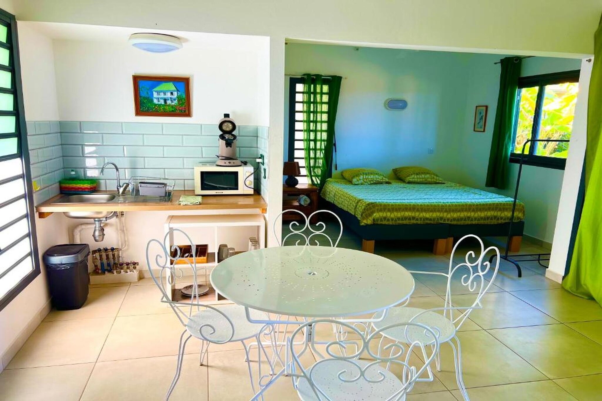 Escape to the oceanfront village of Manapany in Saint-Joseph, where a charming cluster of apartments overlooks Réunion’s wild southern shoreline. Designed for two, this intimate retreat invites slow mornings with sunlit breakfasts on your private terrace, peaceful swims in a sea-view pool, and warm dinners under a starlit sky.
Cozy and welcoming, the apartment includes a modern kitchenette, a living-dining room with a convertible sofa, a queen-size bedroom and a fully equipped bathroom. Practical comforts such as air conditioning, Wi-Fi, barbecue options and attentive on-site staff ensure your stay remains effortless and relaxed.
Step outside to the nearby black-sand shore - just a short walk away - where natural rock pools, dramatic waves and quiet corners create the perfect setting for a romantic escape. For couples seeking extra pampering, the on-site wellness facilities offer a solarium, spa treatments and full-body massages for uninterrupted “we time.”
A five-minute stroll brings you to a lush tropical garden and wide terraces with panoramic views of the bay. Cool off in the inviting pool, wander shaded paths, or simply unwind in the calm surroundings. The estate is fully accessible, welcoming elderly travellers and guests with reduced mobility. When hunger strikes, the on-site restaurant serves vibrant, flavourful Réunionese cuisine.
Whether celebrating something special or simply eager for a quiet coastal getaway, Cap Vanisa blends comfort, romance and the dramatic beauty of Réunion’s southern coast - making it easy to fall in love with the island, and with each other, all over again.